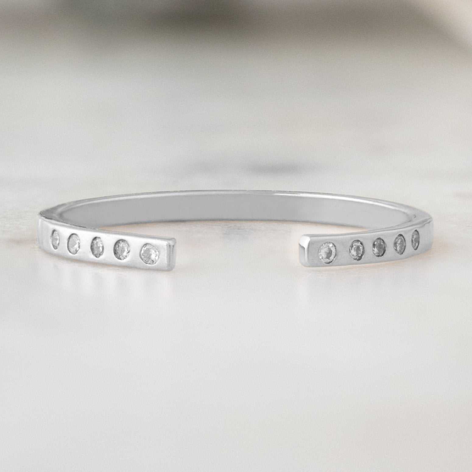 Open Cuff Flush Set Salt and Pepper Diamond Pavé Stacking Band in 14k White Gold on White Marble
