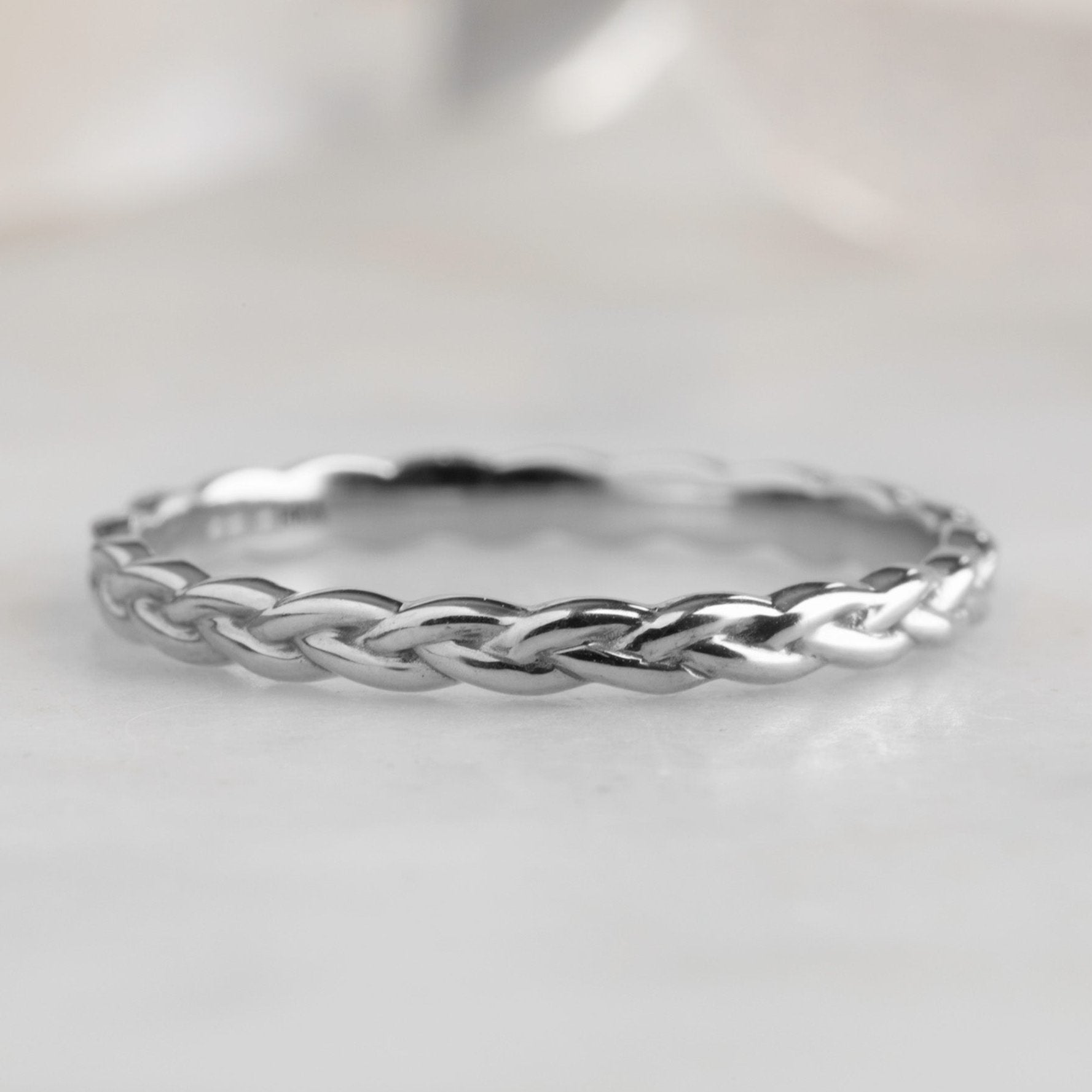 The Gold Braided Stacking Ring in 14k White Gold on White Marble