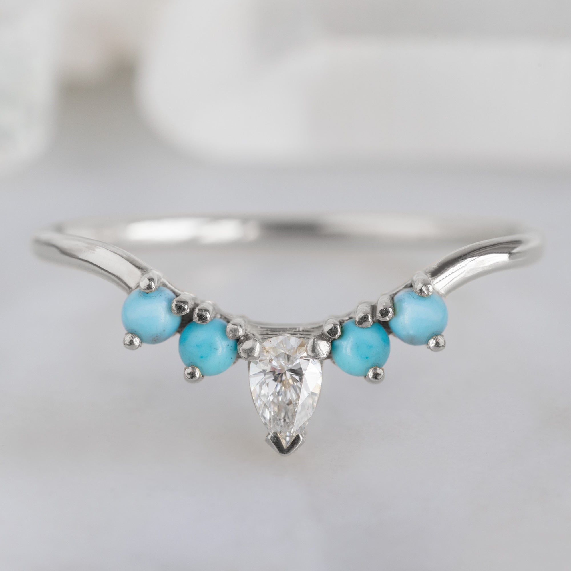 White Diamond and Turquoise 4-Stone Sunburst Stacking Band in 14K White Gold on White Marble Tile
