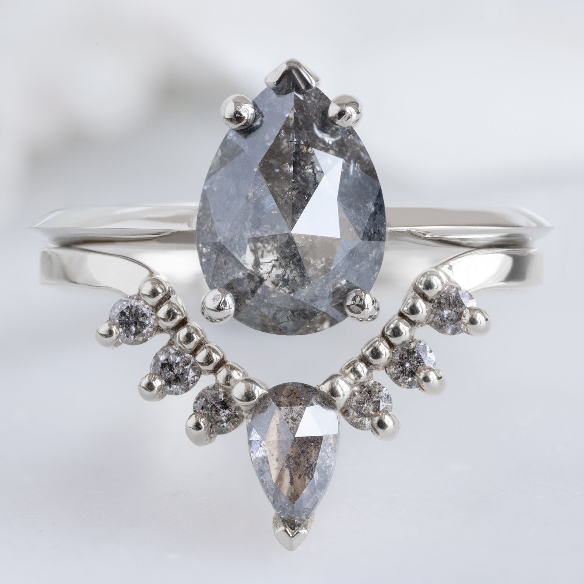 Salt and Pepper Diamond Sunburst Stacking Band in 14K White Gold Stacked with Black Pear Diamond Engagement Ring