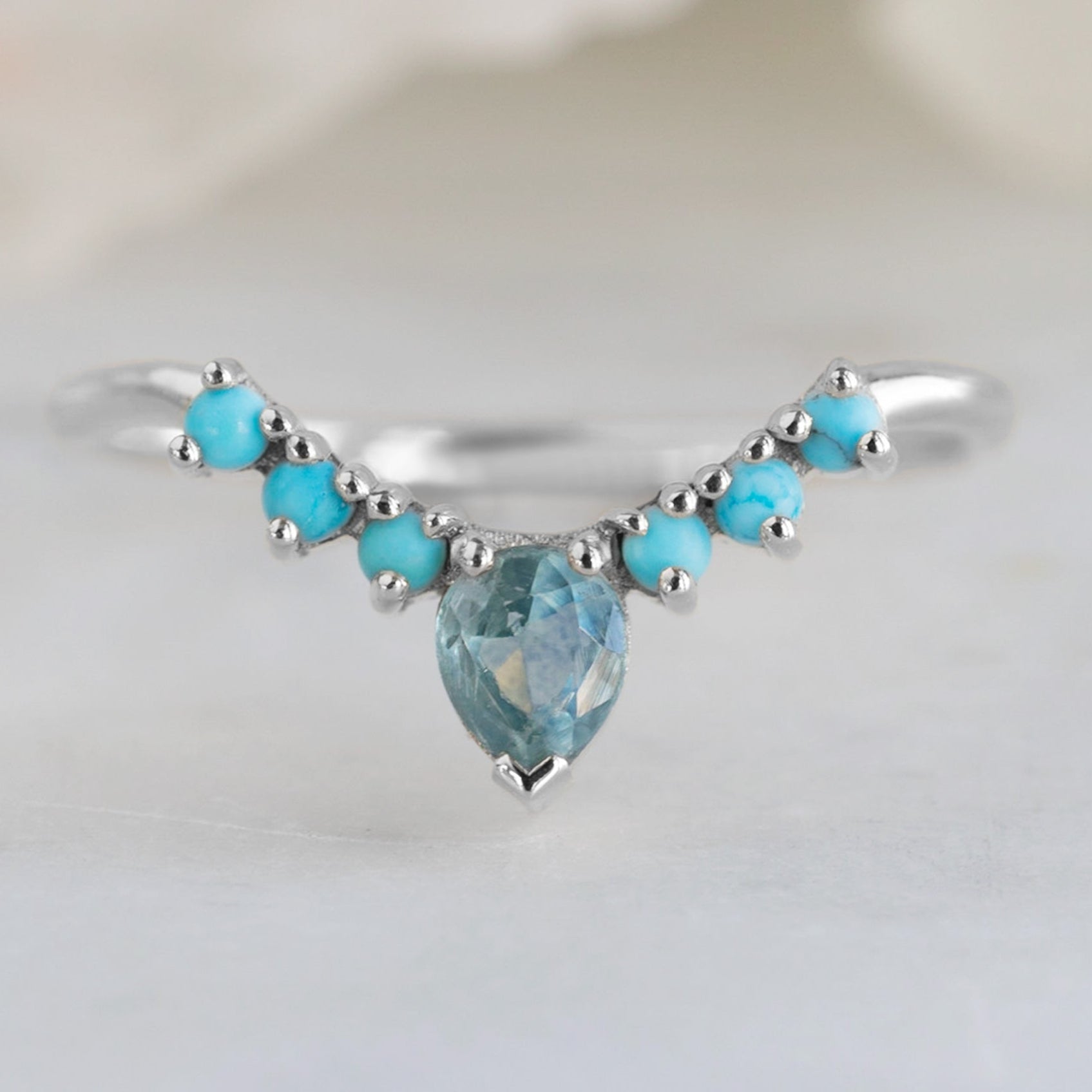 Montana Sapphire and Turquoise Sunburst Stacking Band in 14K White Gold on White Marble Tile