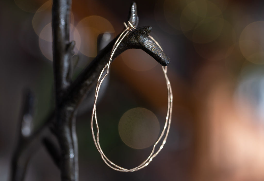 Organic Hoop Earrings hanging on metal earring tree
