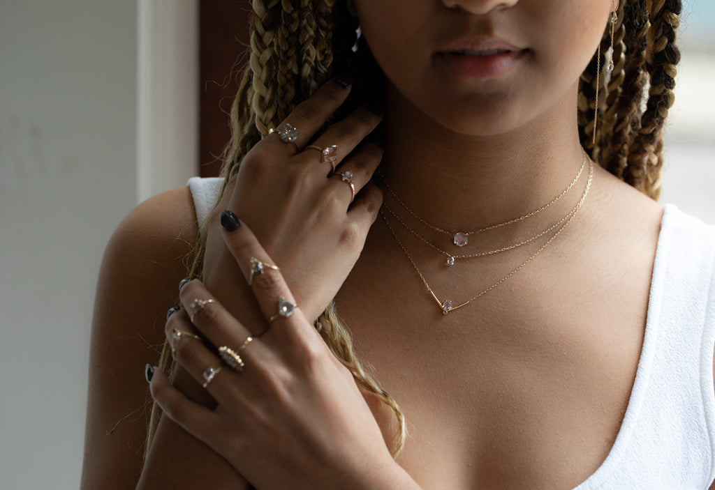 model wearing all Alexis Russell Jewelry including engagement rings, necklaces and earrings