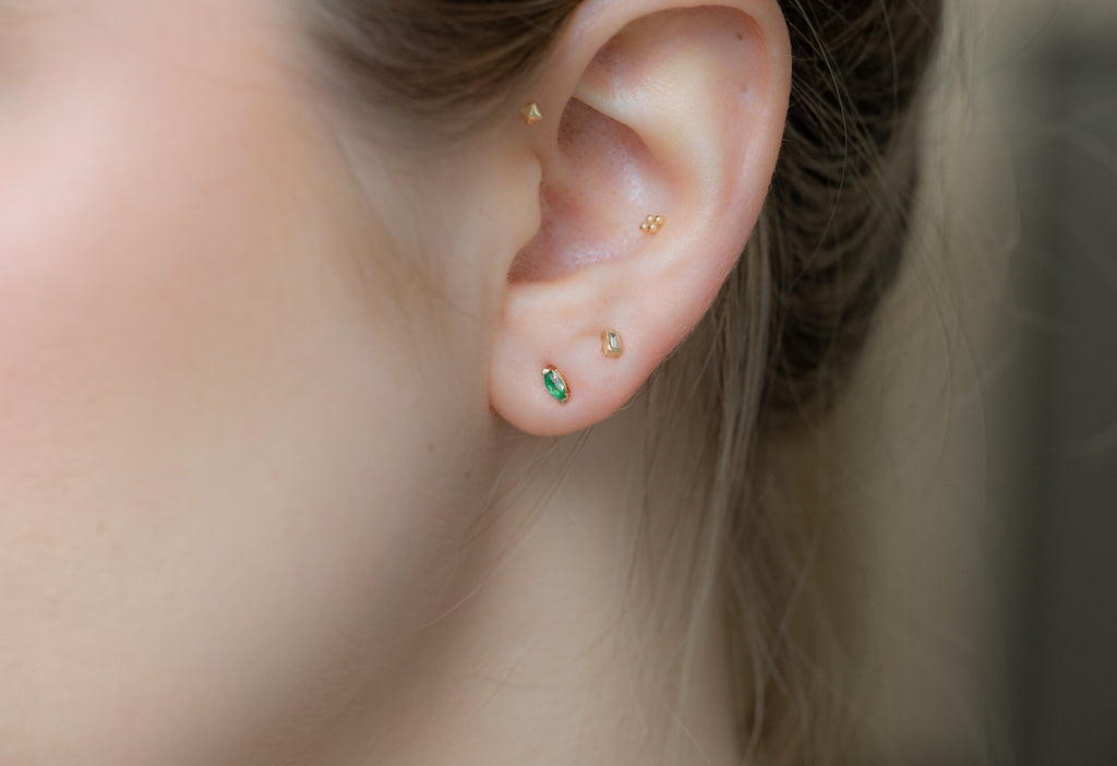 Teensy Emerald Stud Earrings Sacked on Model