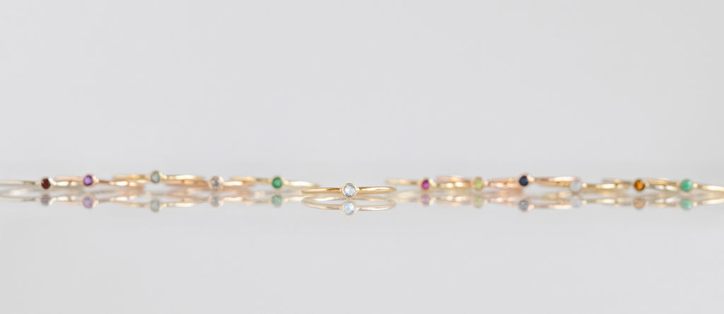 Moonstone Stacking Ring Featured with Other Birthstone Stacking Rings Behind