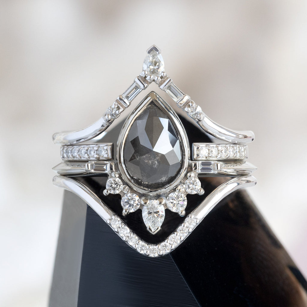 Black Diamond Engagement Rings Sitting on White Crystal