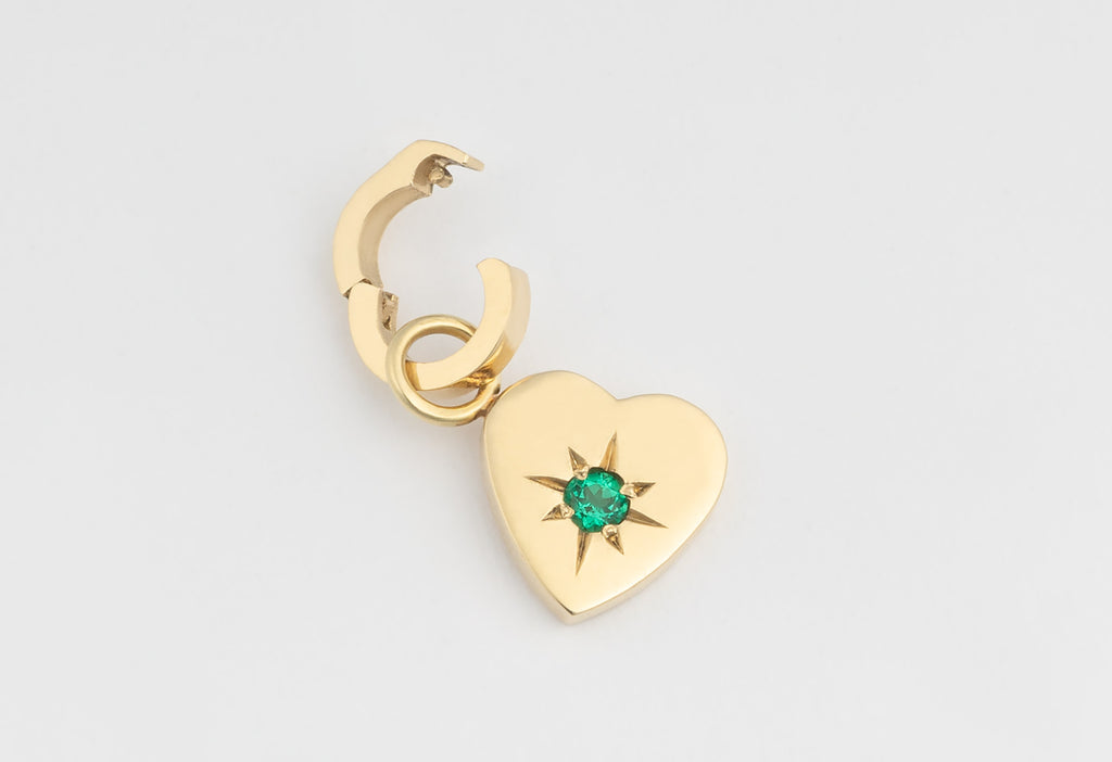 10k Yellow Gold Emerald Heart Charm with Open Interchangeable Charm Link on White Textured Paper