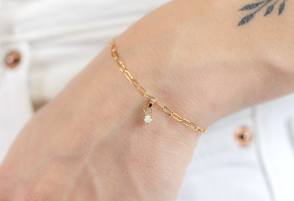 10k Yellow Gold Opal Birthstone Charm on Charm Bracelet on Model