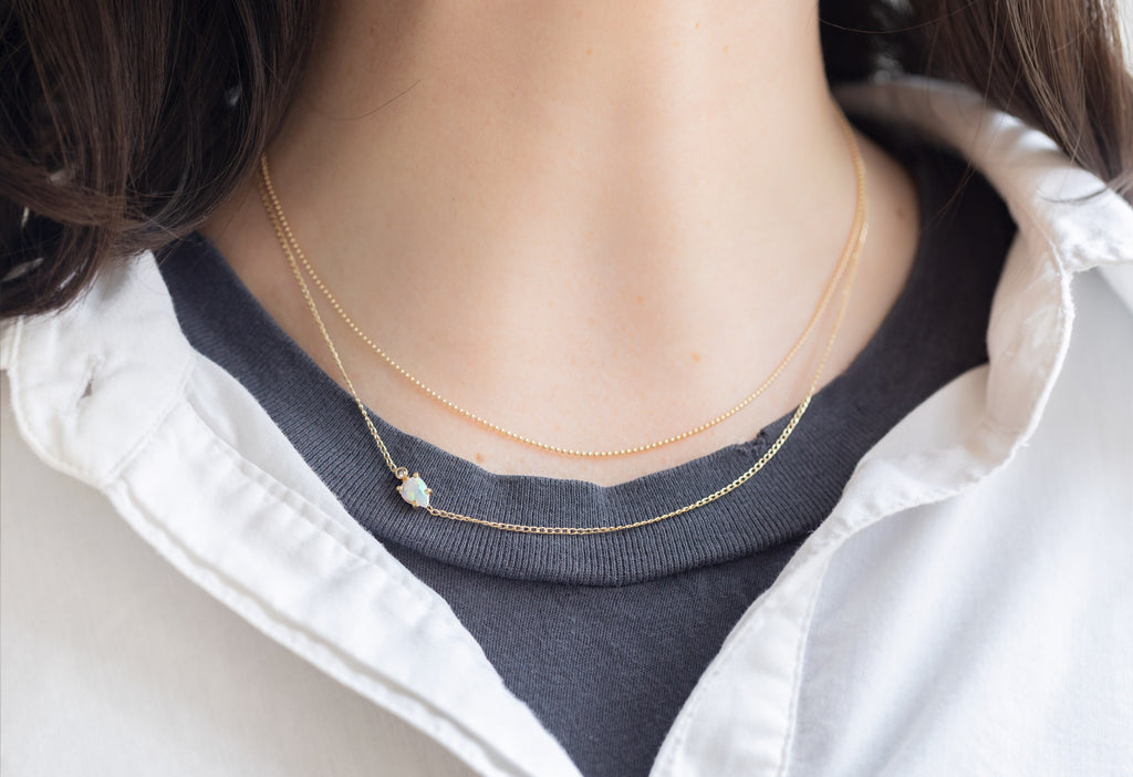 Asymmetrical Opal + Diamond Necklace Stacked on Model