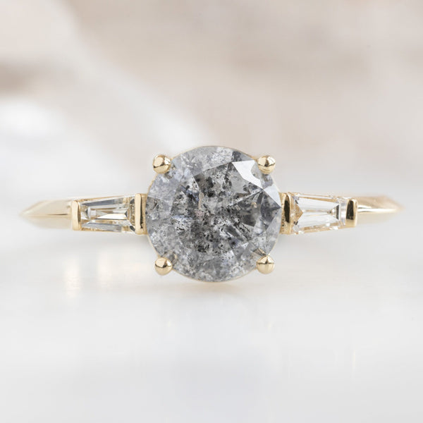 The Ash Ring | 1.22ct Round Salt and Pepper Diamond in 14K Yellow Gold with white blurred background. 