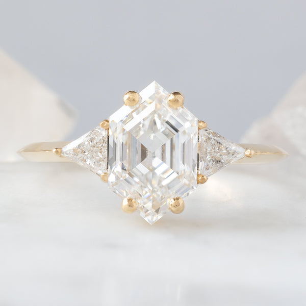 The Jade Ring on 1.65ct Hexagon White Lab Grown Diamond in 14K Yellow Gold on white and blue background