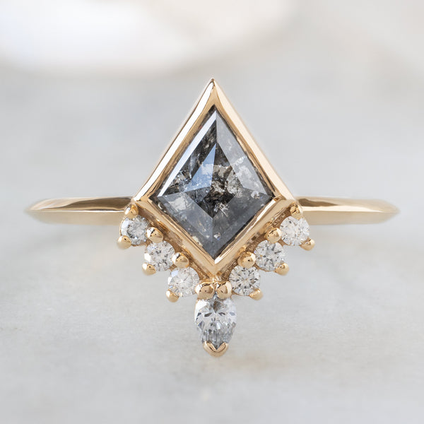 The Aster Ring with a 1.02ct Kite Salt and Pepper Diamond in 14K Yellow Gold on White Marble