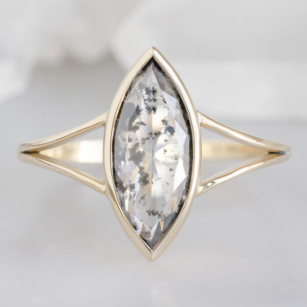 The Magnolia Ring with a 1.65ct Lab Grown Salt and Pepper Diamond in 14K Yellow Gold on White Marble