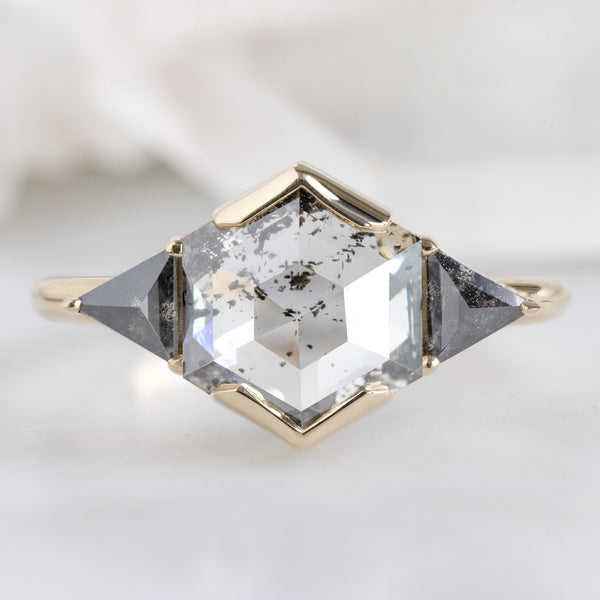 The Jade Ring with a 1.72ct Hexagon Lab Grown Salt and Pepper Diamond in 14K Yellow Gold on White Marble