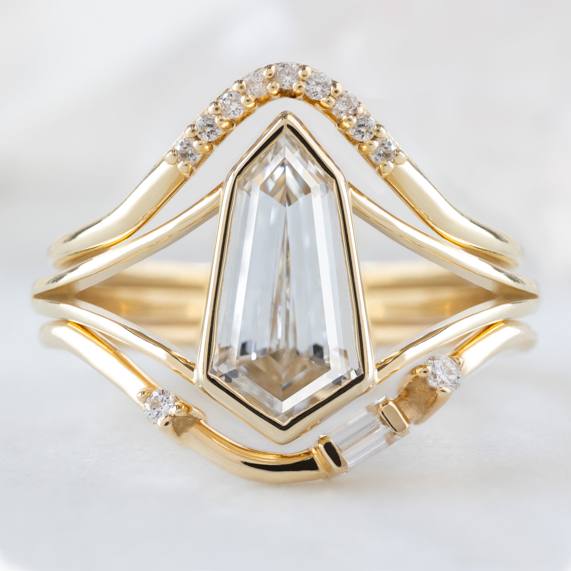 buy:white-diamond-pave-peak-stacking-band-14k-or-18k-yellow-gold,the-magnolia-ring-1-50ct-lab-grown-geometric-white-diamond-in-14k-yellow-gold,asymmetrical-baguette-diamond-arc-stacking-band-in-14k-yellow-gold