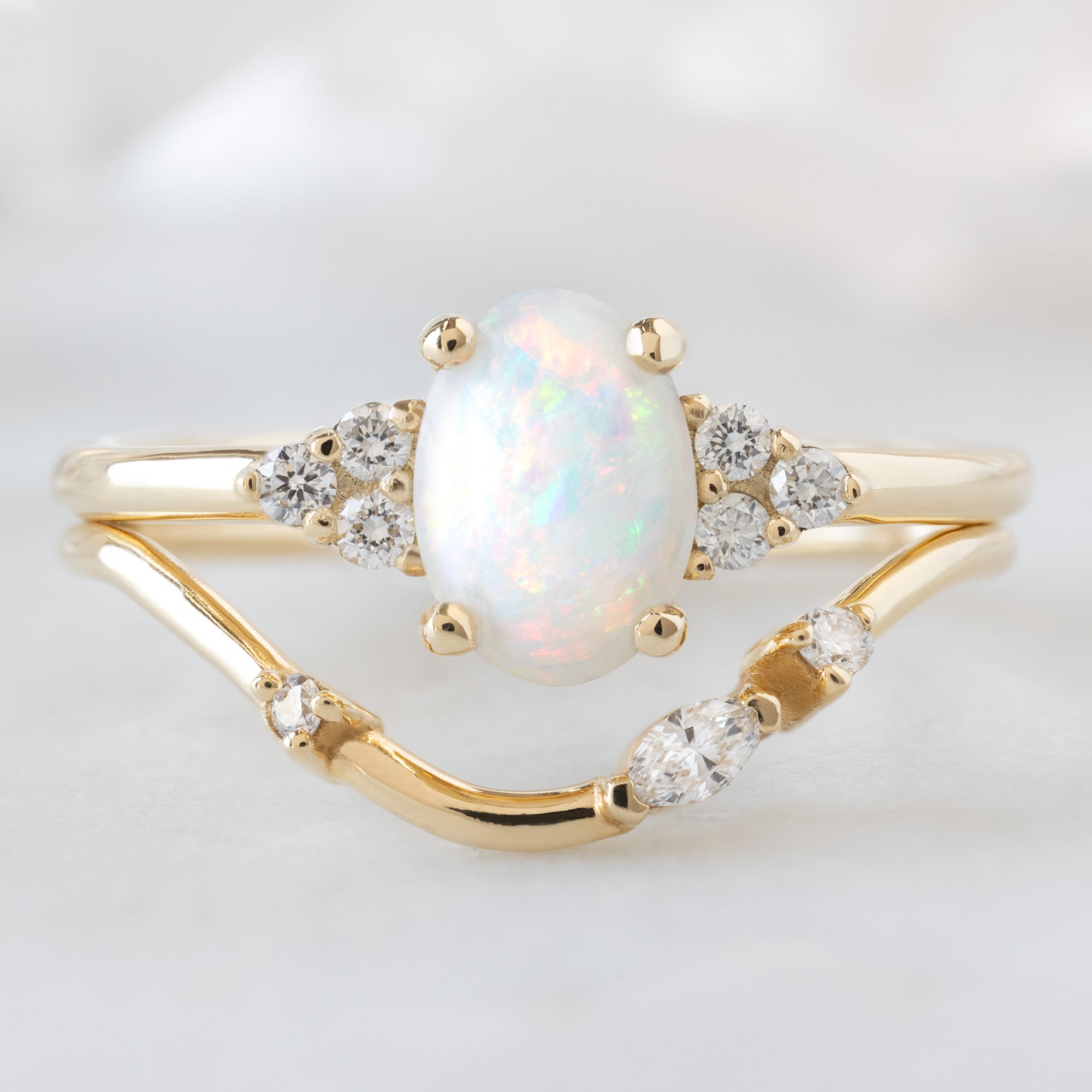 The Ivy Ring with a 0.44ct Oval Australian Opal in 14K Yellow Gold  Stacked with the Asymmetrical Marquise Arc Stacking Band