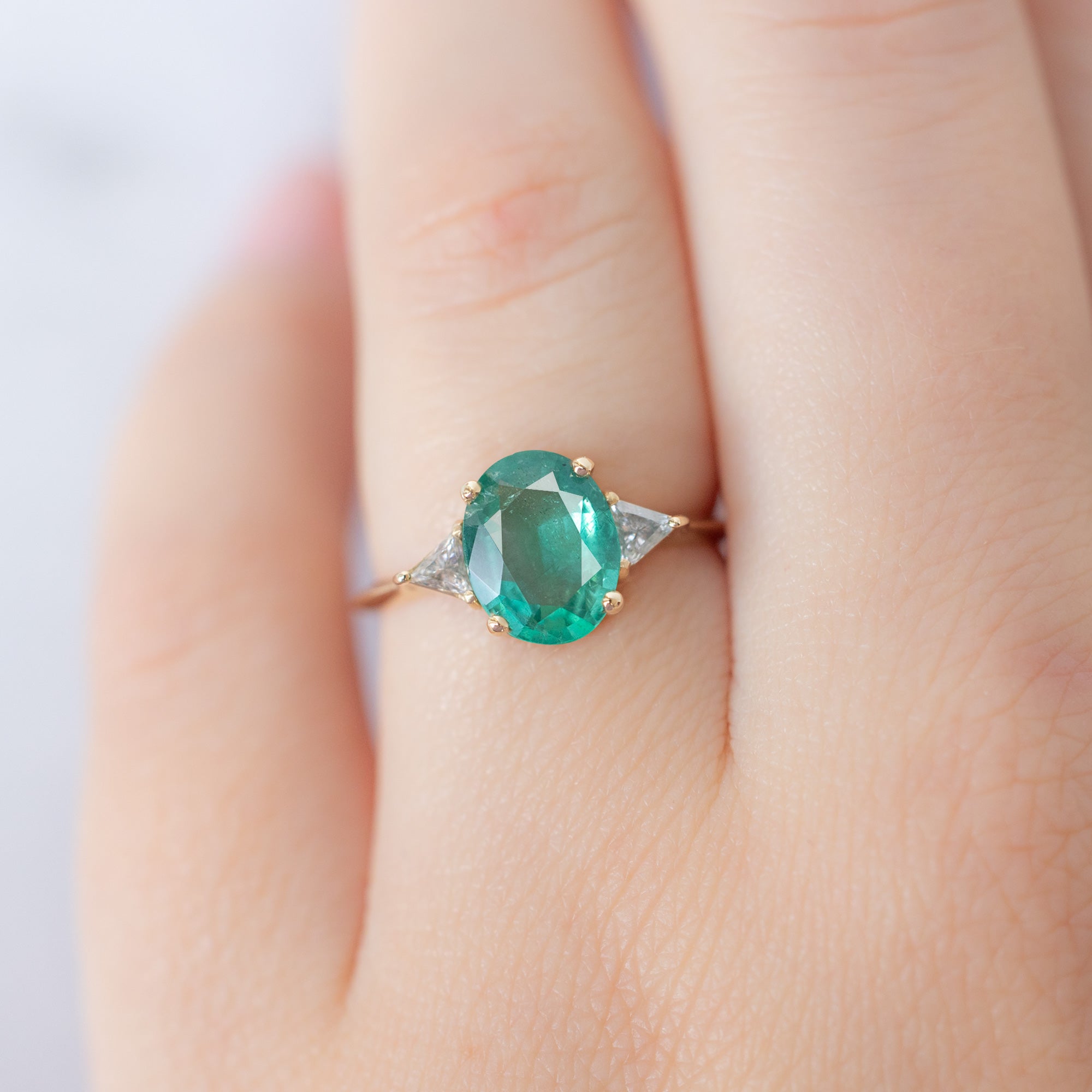 The Jade Ring with a 1.27ct Oval Emerald in 14K Yellow Gold on Model