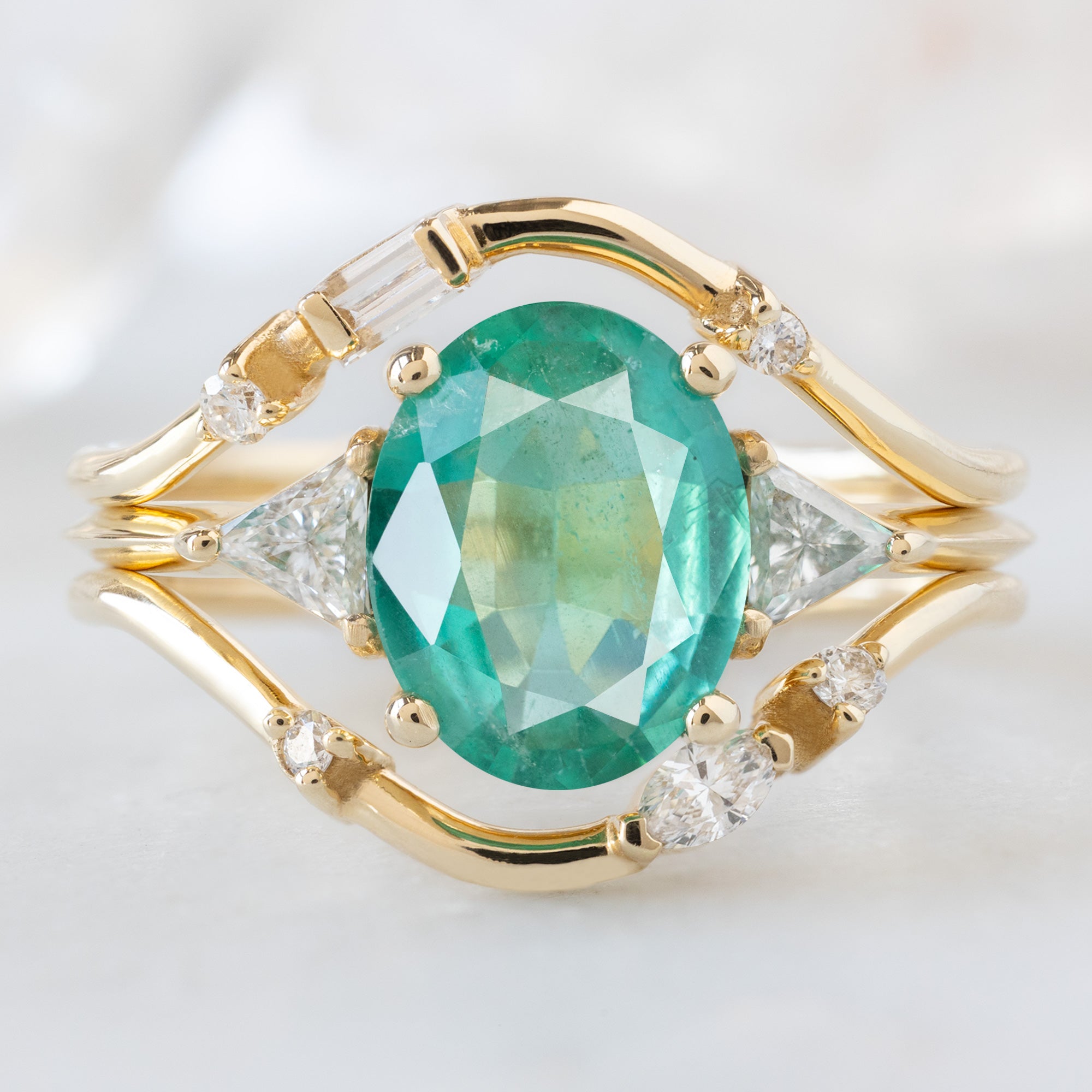 buy:asymmetrical-baguette-diamond-arc-stacking-band-in-14k-yellow-gold,the-jade-ring-1-27ct-oval-emerald-in-14k-yellow-gold,asymmetrical-marquise-diamond-arc-stacking-band-in-14k-yellow-gold