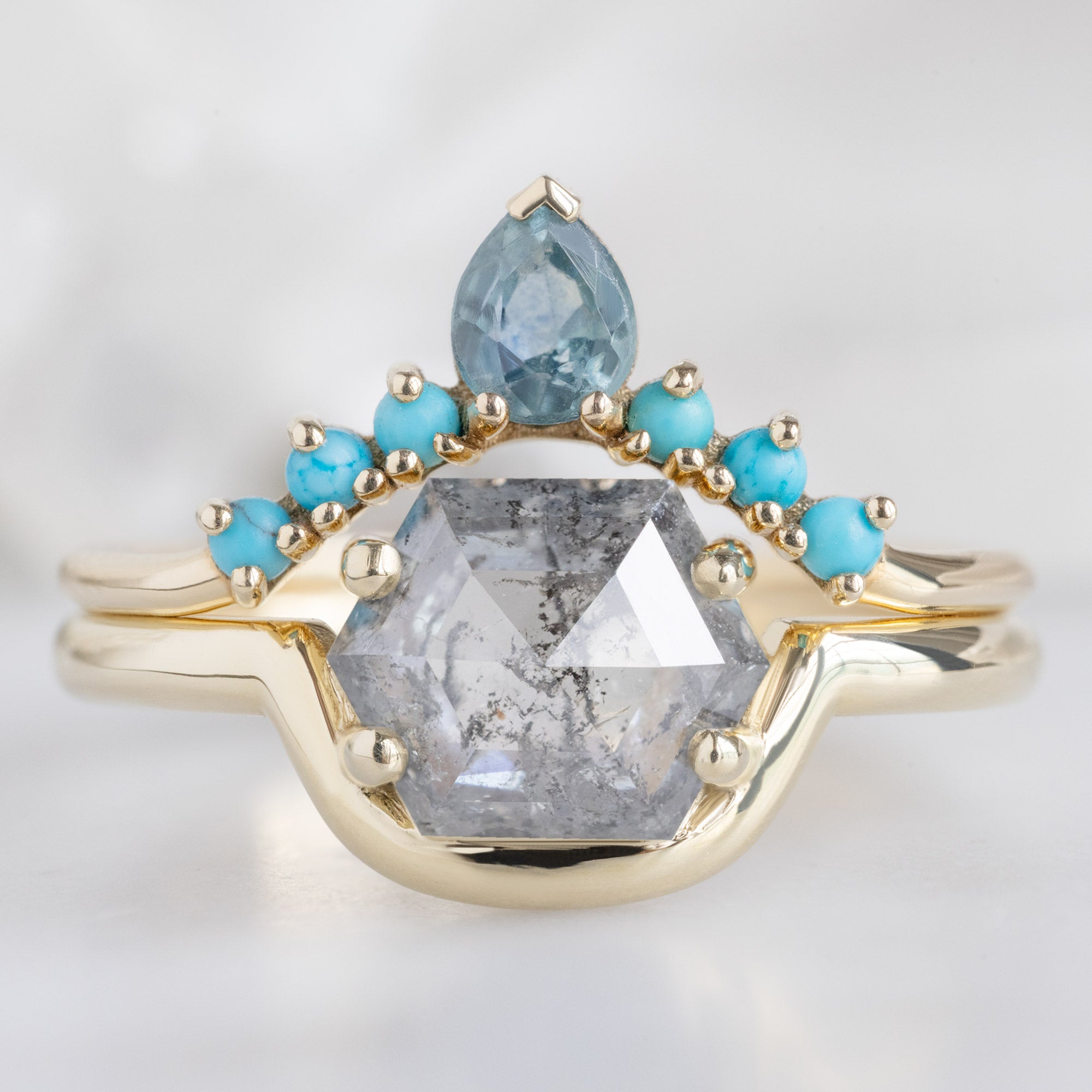 The Wave Ring with a 1.37ct Hexagon Salt and Pepper Diamond in 14K Yellow Gold Stacked with Sapphire and Turquoise Sunburst Stacking Band