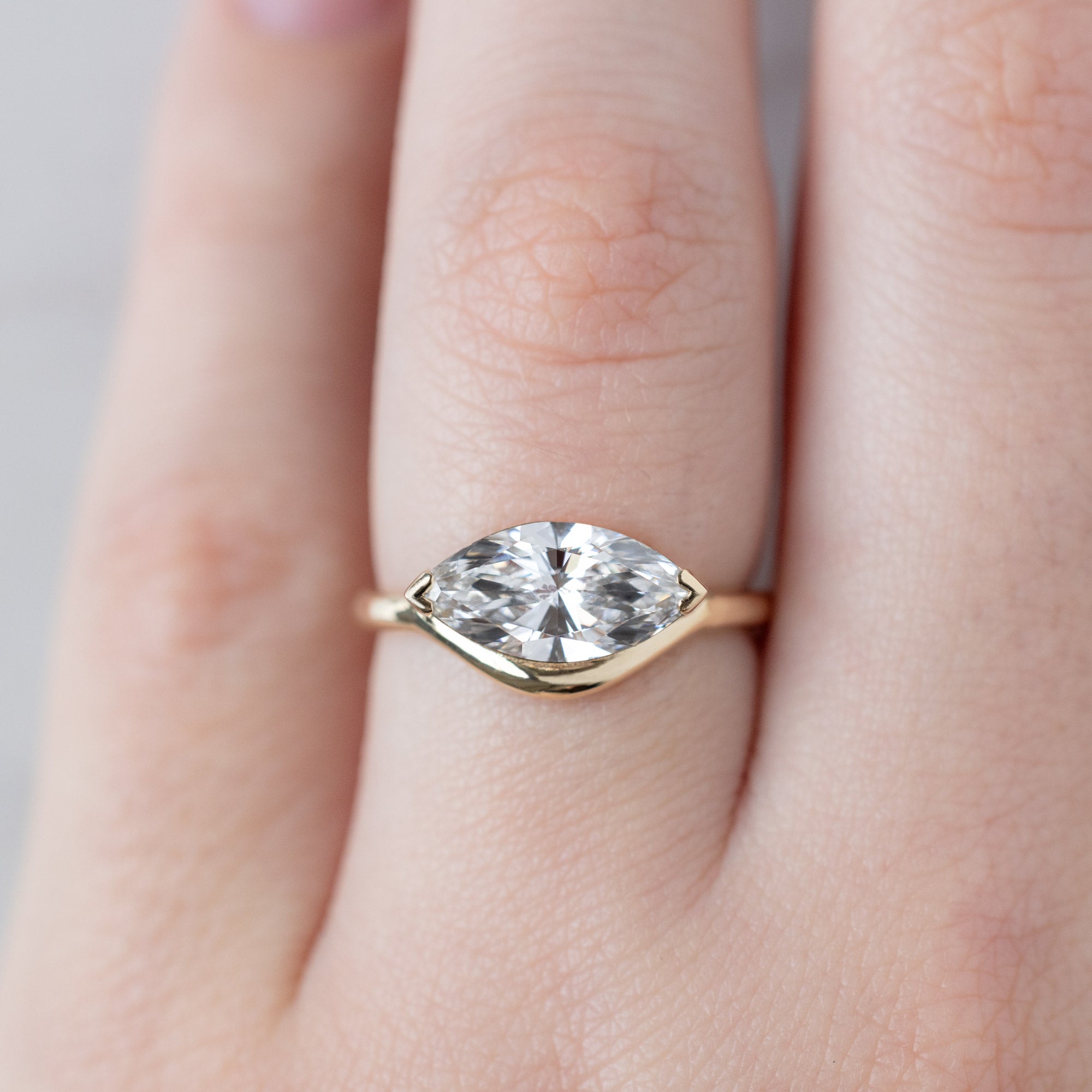 The Wave Ring with a 1.50ct Marquise Lab Grown White Diamond in 14K Yellow Gold on Model on Model