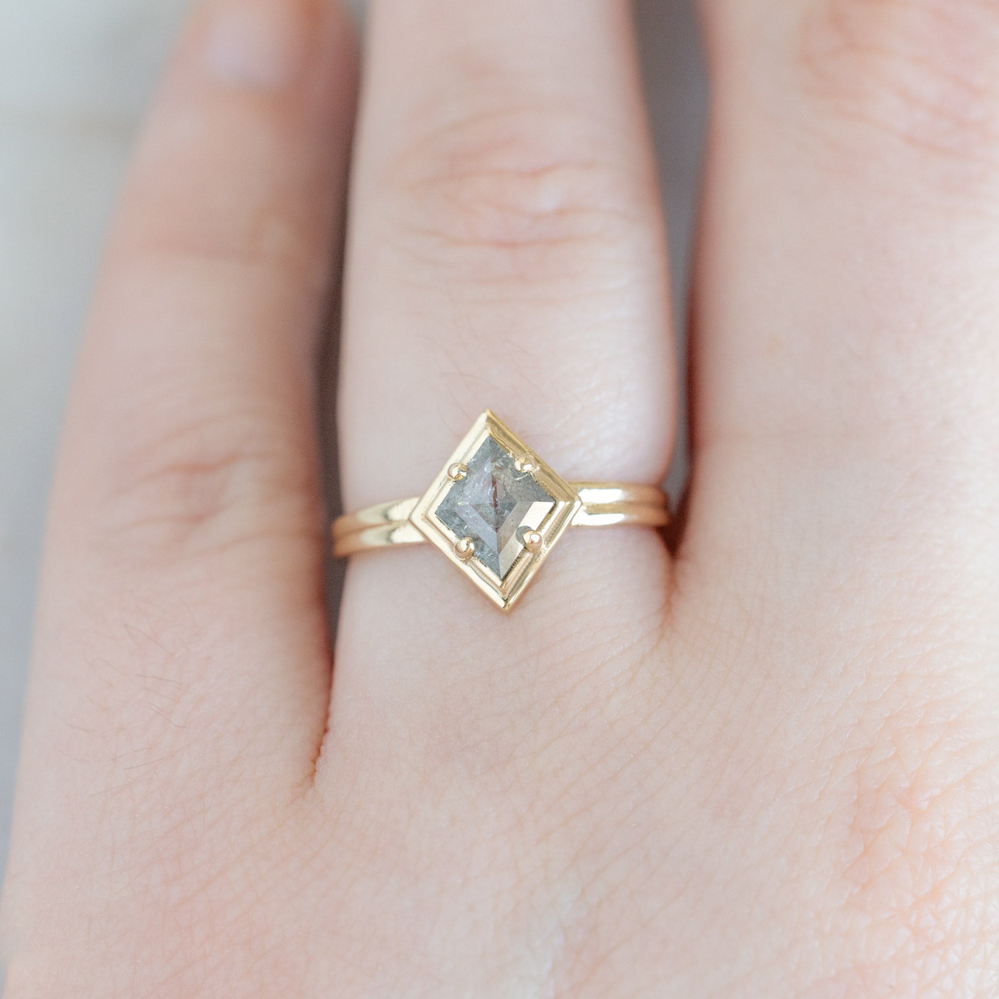 The Stratum Ring with a .65ct Kite Salt and Pepper Diamond in 14K Yellow Gold on Model