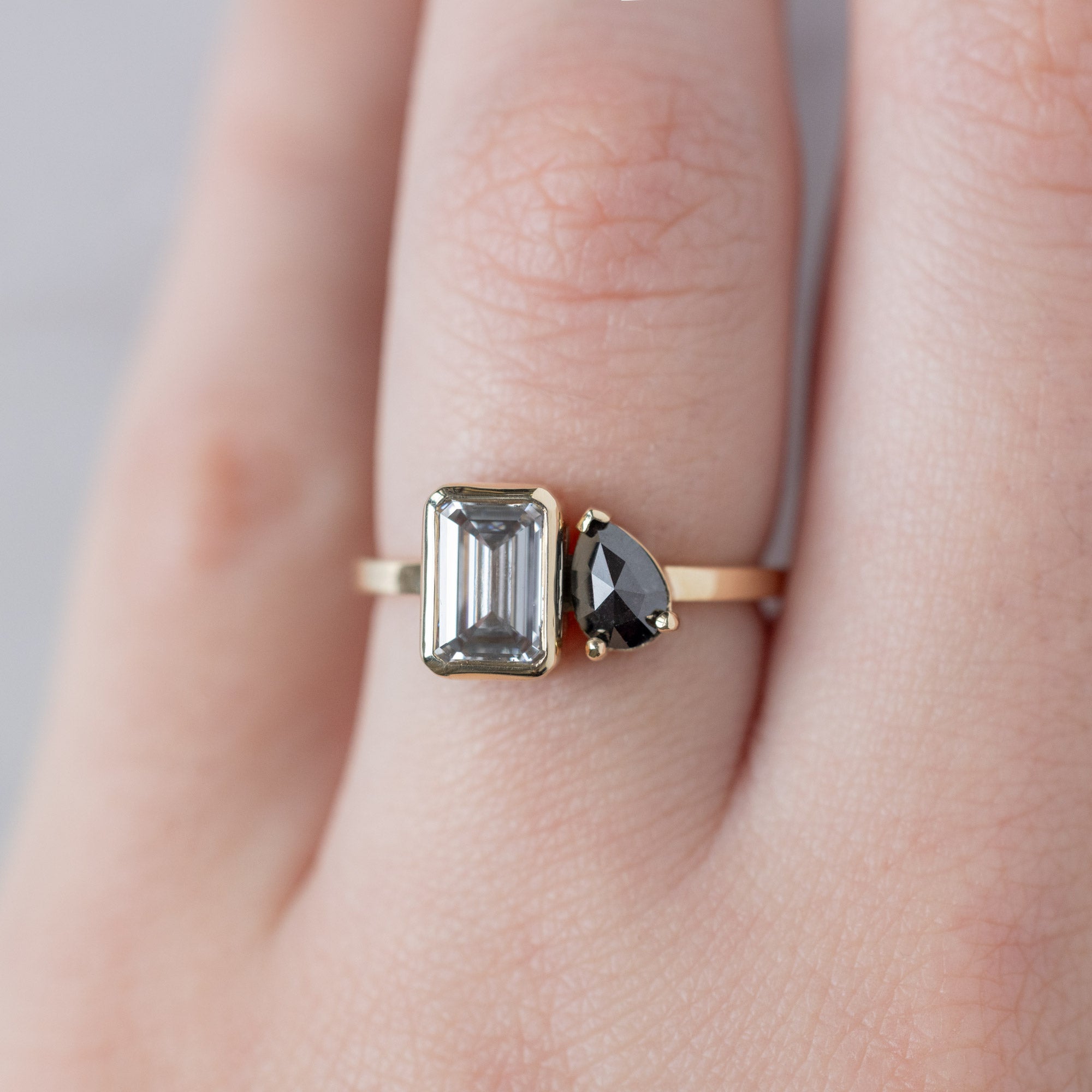 The You and Me Ring with a 1.25ct Emerald Cut Lab Grown White Diamond in 14K Yellow Gold on Model