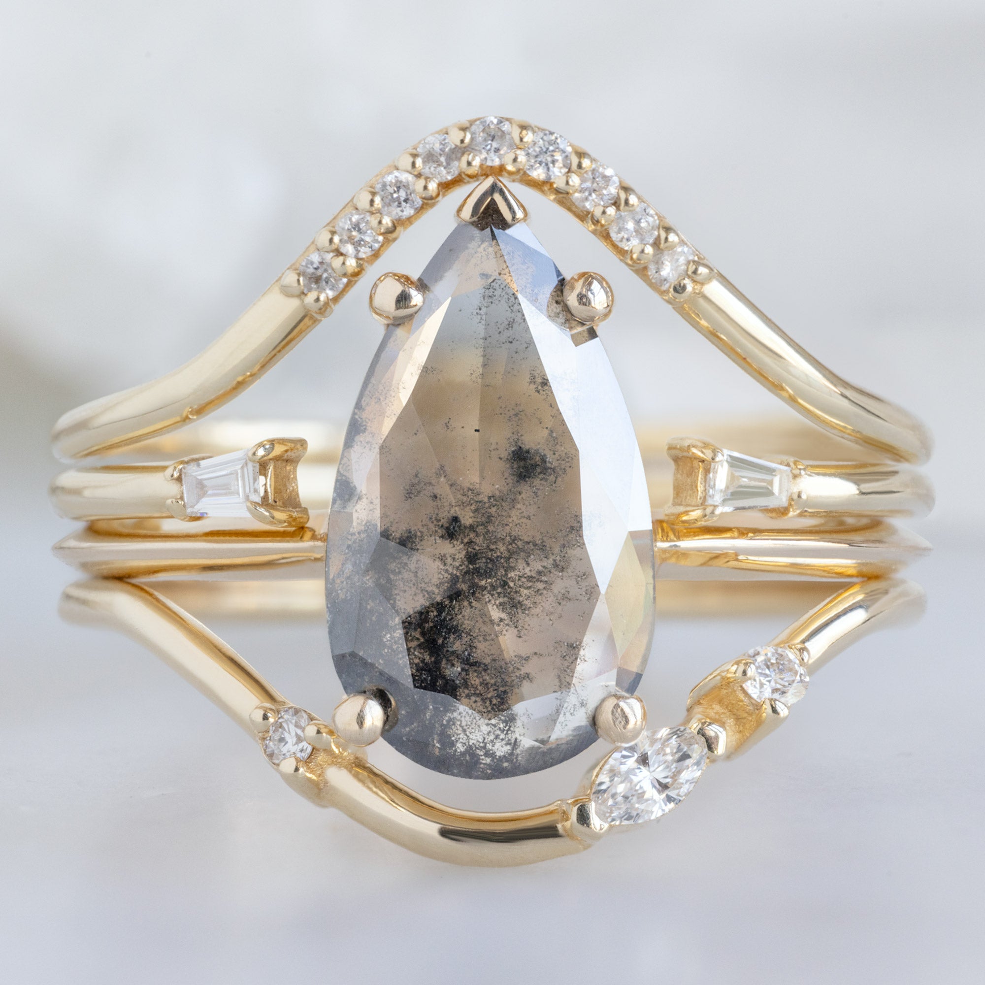 buy:white-diamond-pave-peak-stacking-band-14k-or-18k-yellow-gold,open-cuff-baguette-white-diamond-stacking-band-14k-or-18k-yellow-gold,the-sage-ring-1-19ct-pear-lab-grown-salt-and-pepper-diamond,asymmetrical-marquise-diamond-arc-stacking-band-in-14k-yellow-gold