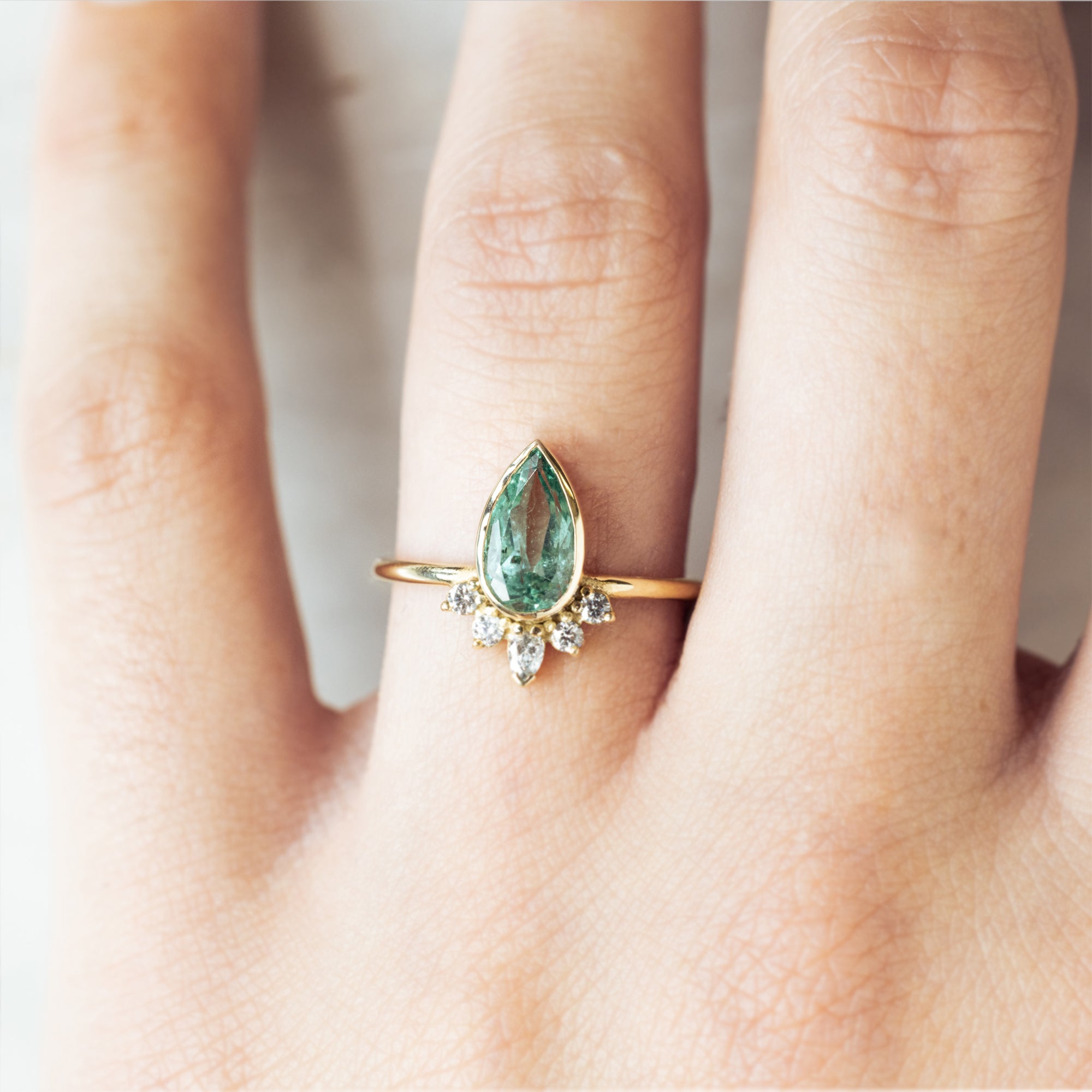 Alexis Russell  Engagement Rings The Aster Ring | with a 1.38ct Pear Emerald in 14K Yellow Gold