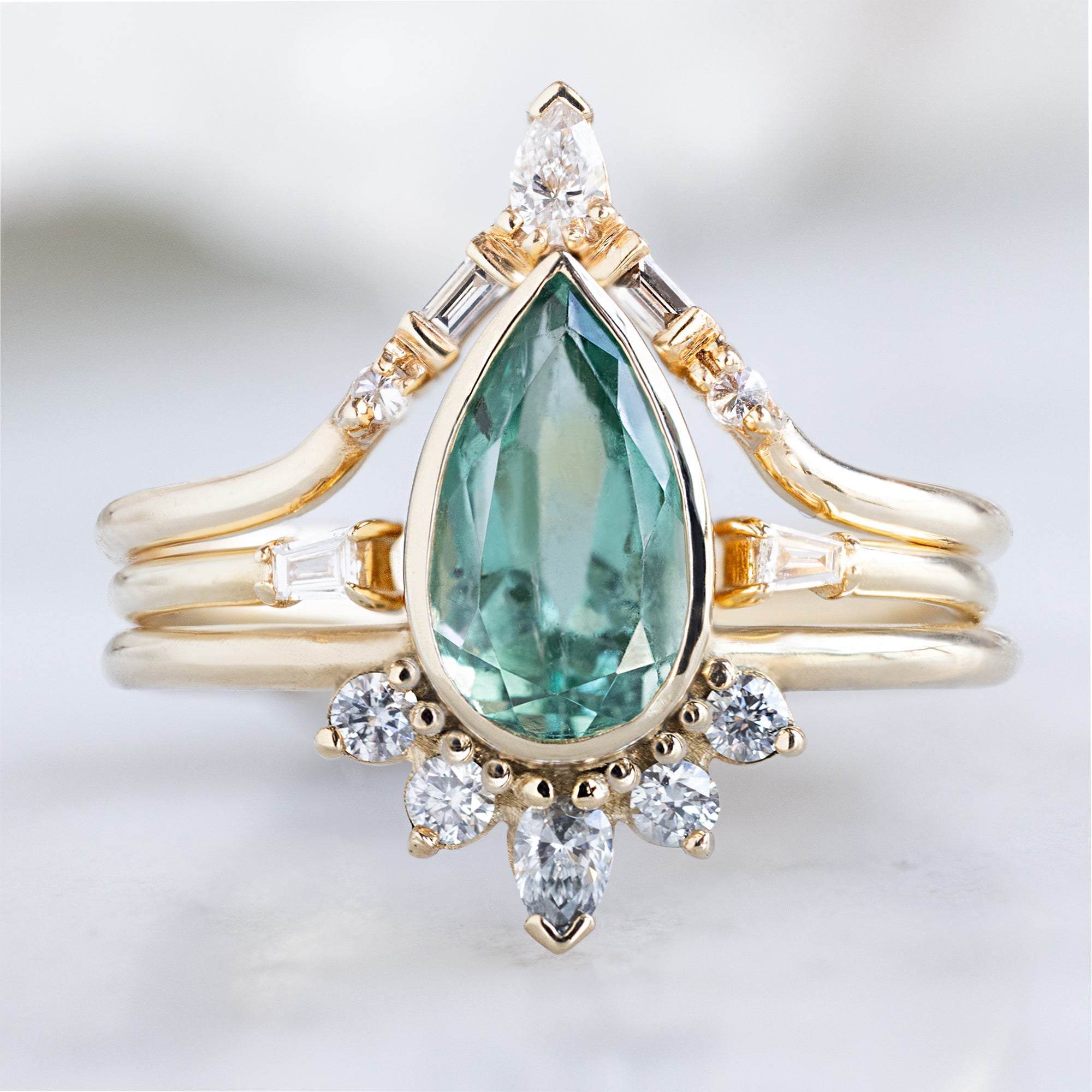 buy:white-diamond-tiara-stacking-band-14k-or-18k-yellow-gold,open-cuff-baguette-white-diamond-stacking-band-14k-or-18k-yellow-gold,the-aster-ring-with-a-1-38ct-pear-emerald-in-14k-yellow-gold