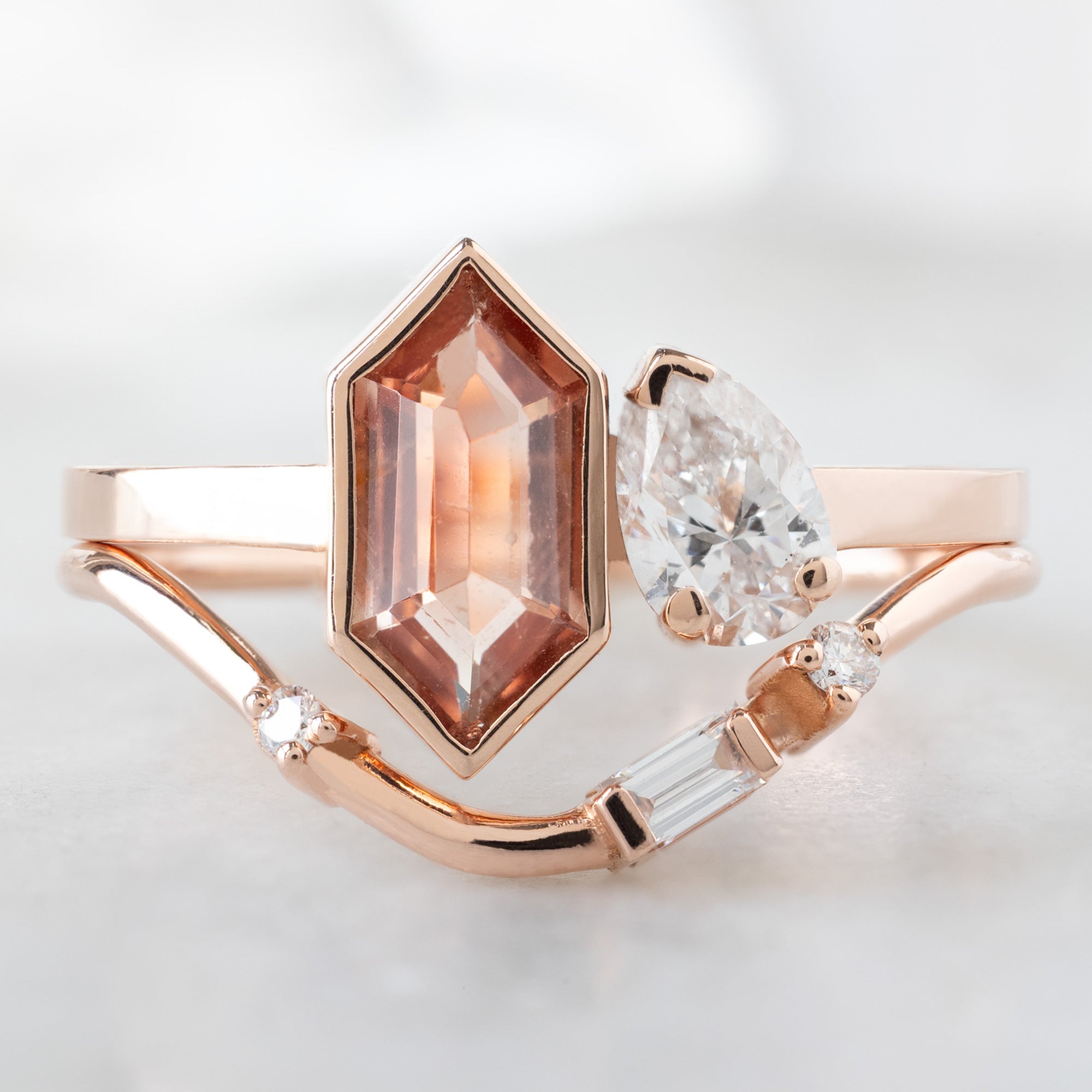 The You and Me Ring with a 0.60ct Hexagon Sunstone in 14K Rose Gold Stacked with the Asymmetrical Baguette Arc Stacking Band