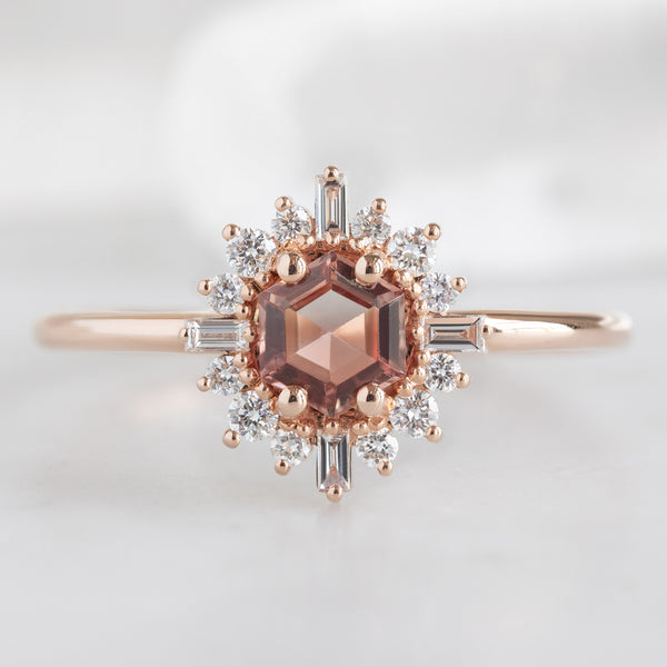 The Compass Ring with a 0.37ct Hexagon Sunstone in 14K Rose Gold on White Marble