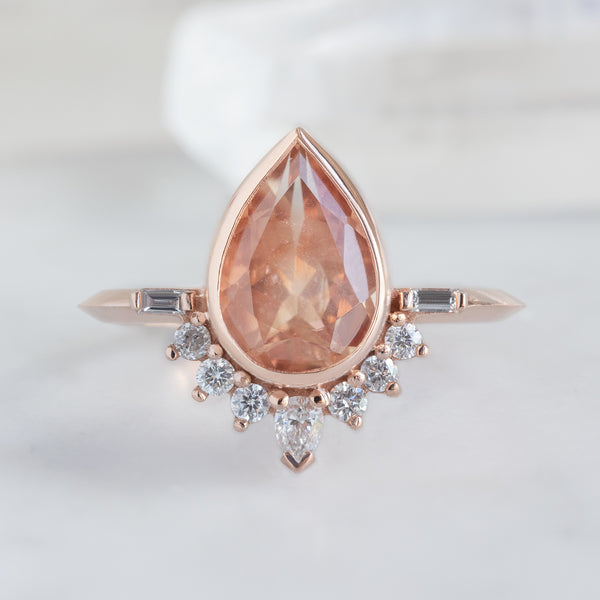 The Posy Ring with a 1.73ct Pear Cut Sunstone in 14K Rose Gold on White Background