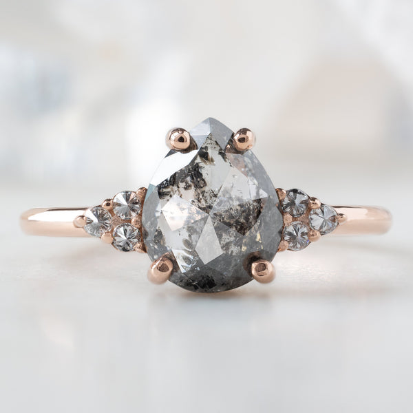 The Ivy Ring with a 1.37ct Pear Salt and Pepper Diamond in 14K Rose Gold on White Marble