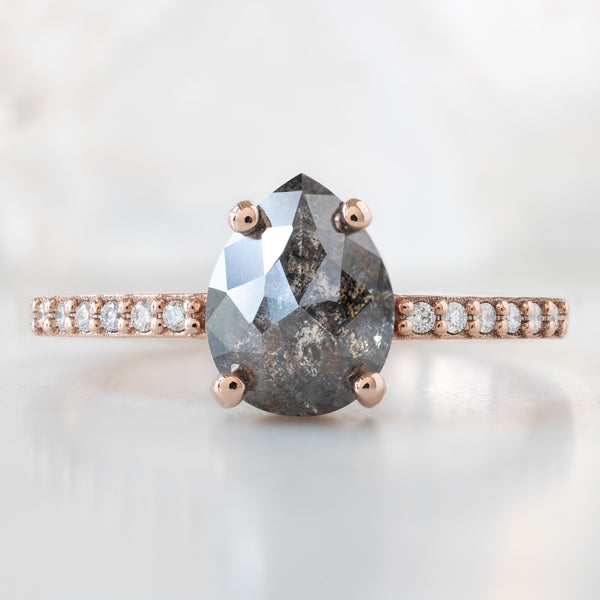 The Willow Ring with a 1.38ct Pear Black Diamond in 14K Rose Gold on White Marble