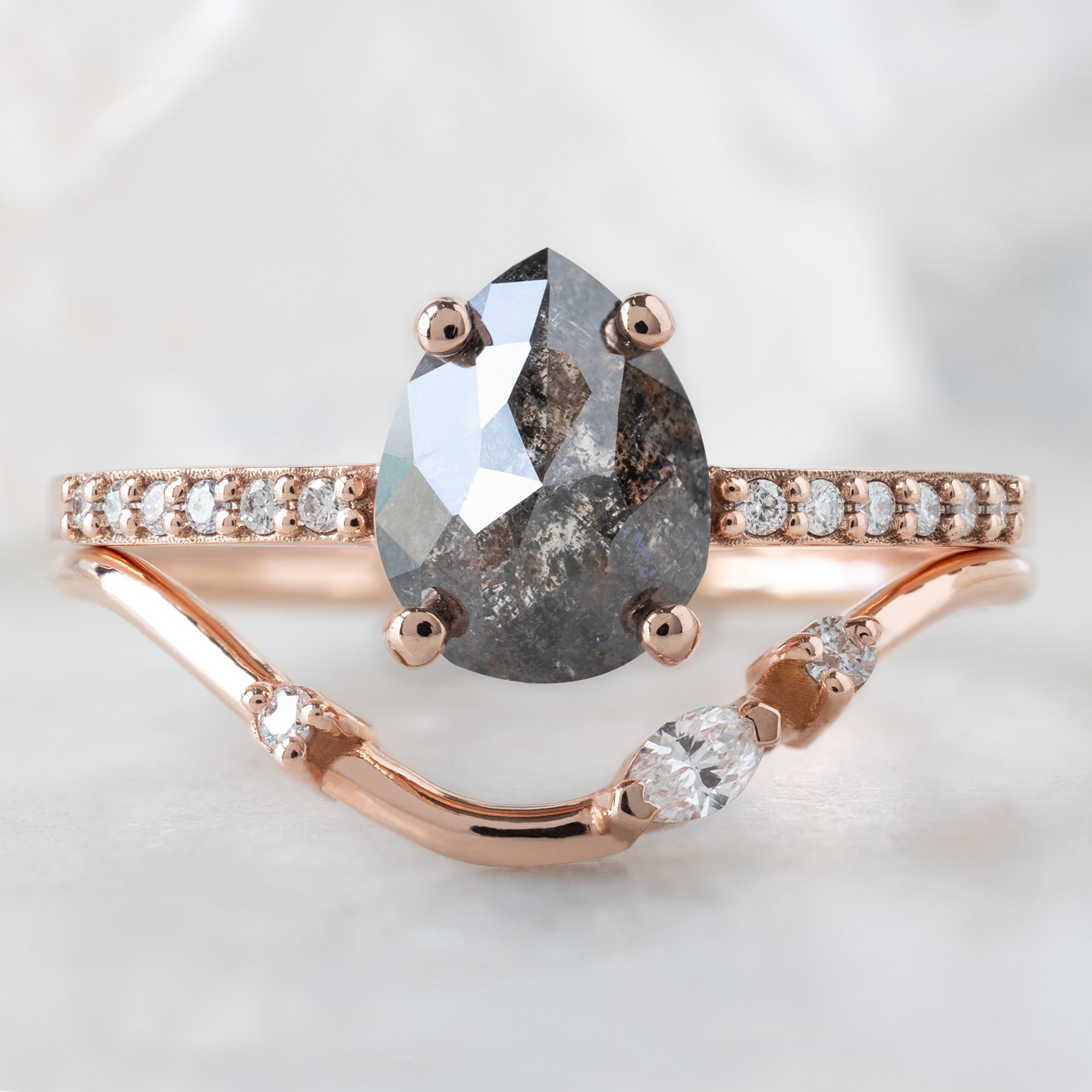 The Willow Ring with a 1.38ct Pear Black Diamond in 14K Rose Gold Stacked with the Asymmetrical Marquise Diamond Arc Stacking Band