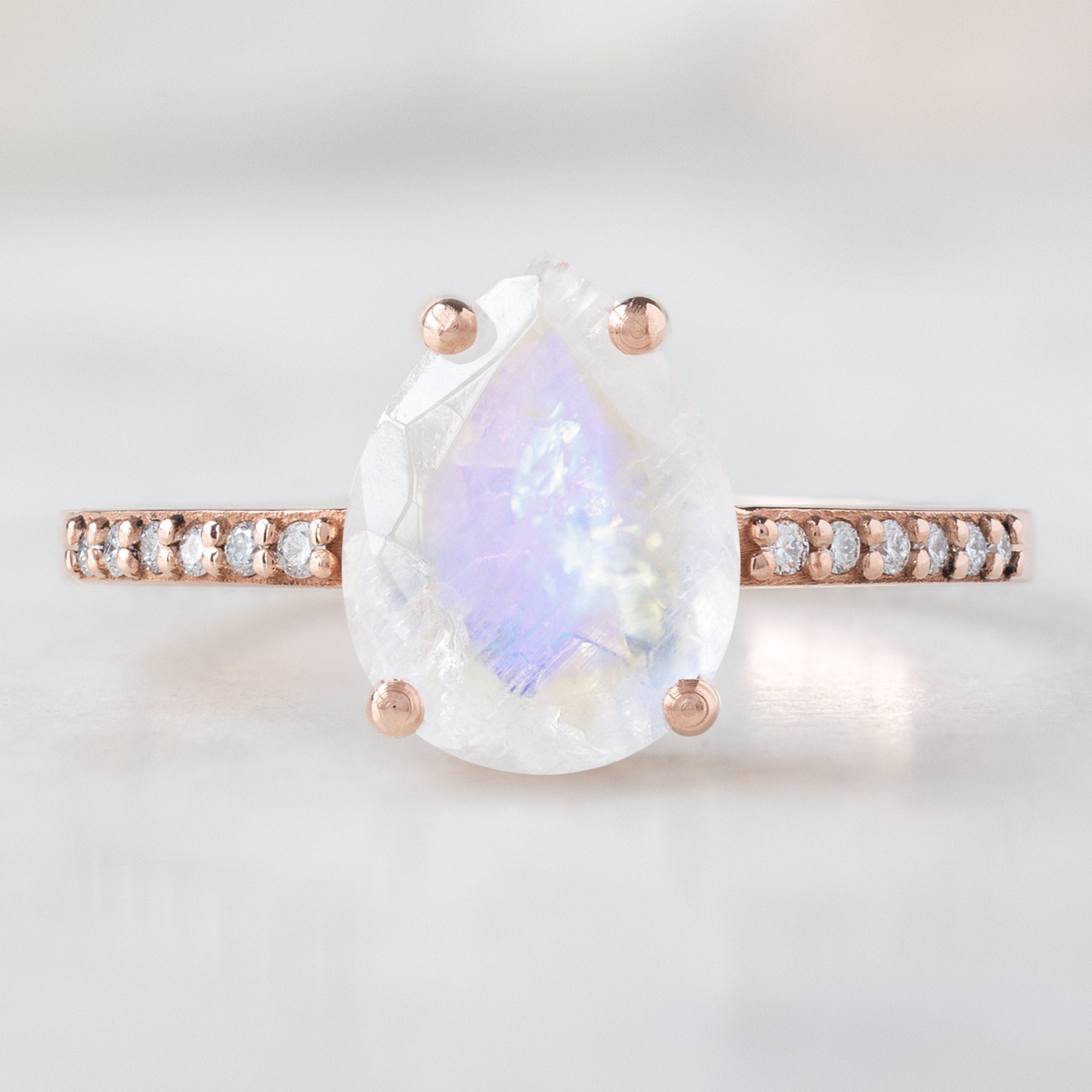The Willow Ring with a 1.66ct Pear Moonstone in 14K Rose Gold on White Marble