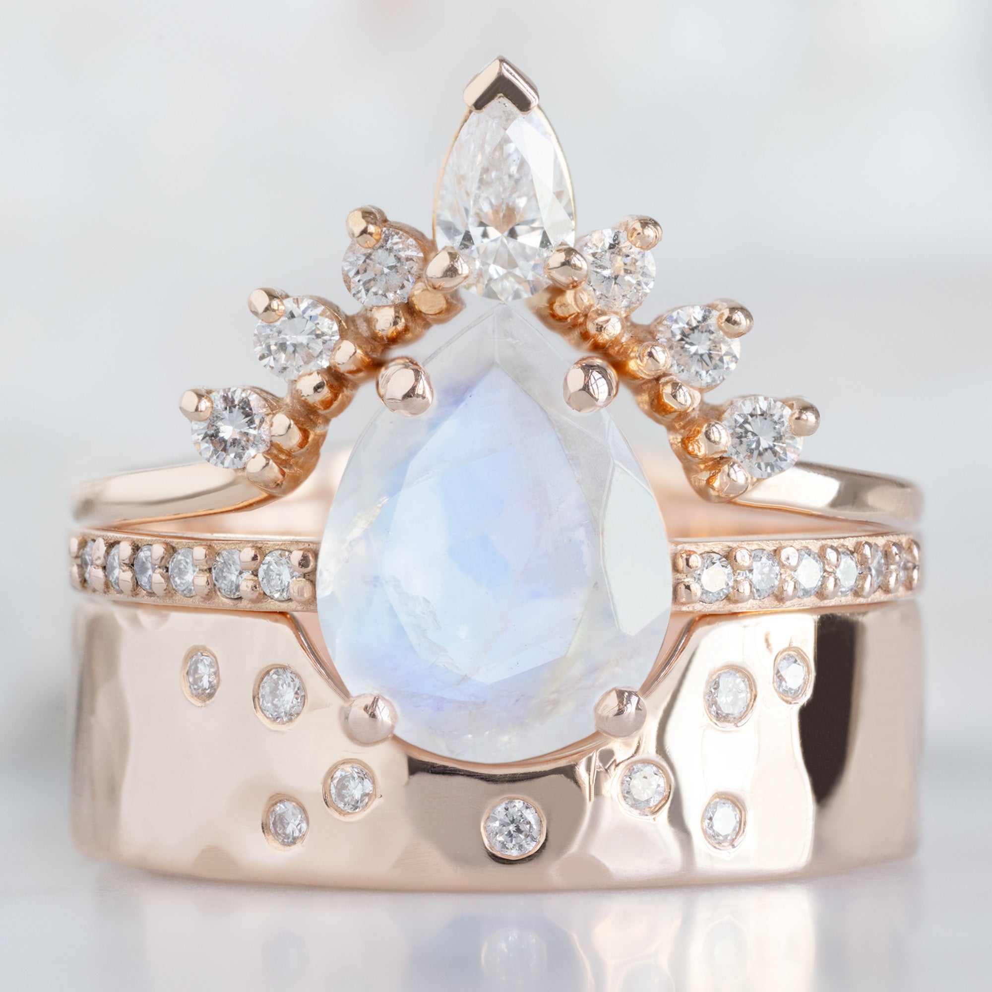 buy:white-pear-diamond-sunburst-stacking-band-14k-gold,the-willow-ring-1-66ct-pear-moonstone-in-14k-rose-gold,constellation-cut-out-stacking-band-arc-cut-out-in-14k-yellow-gold