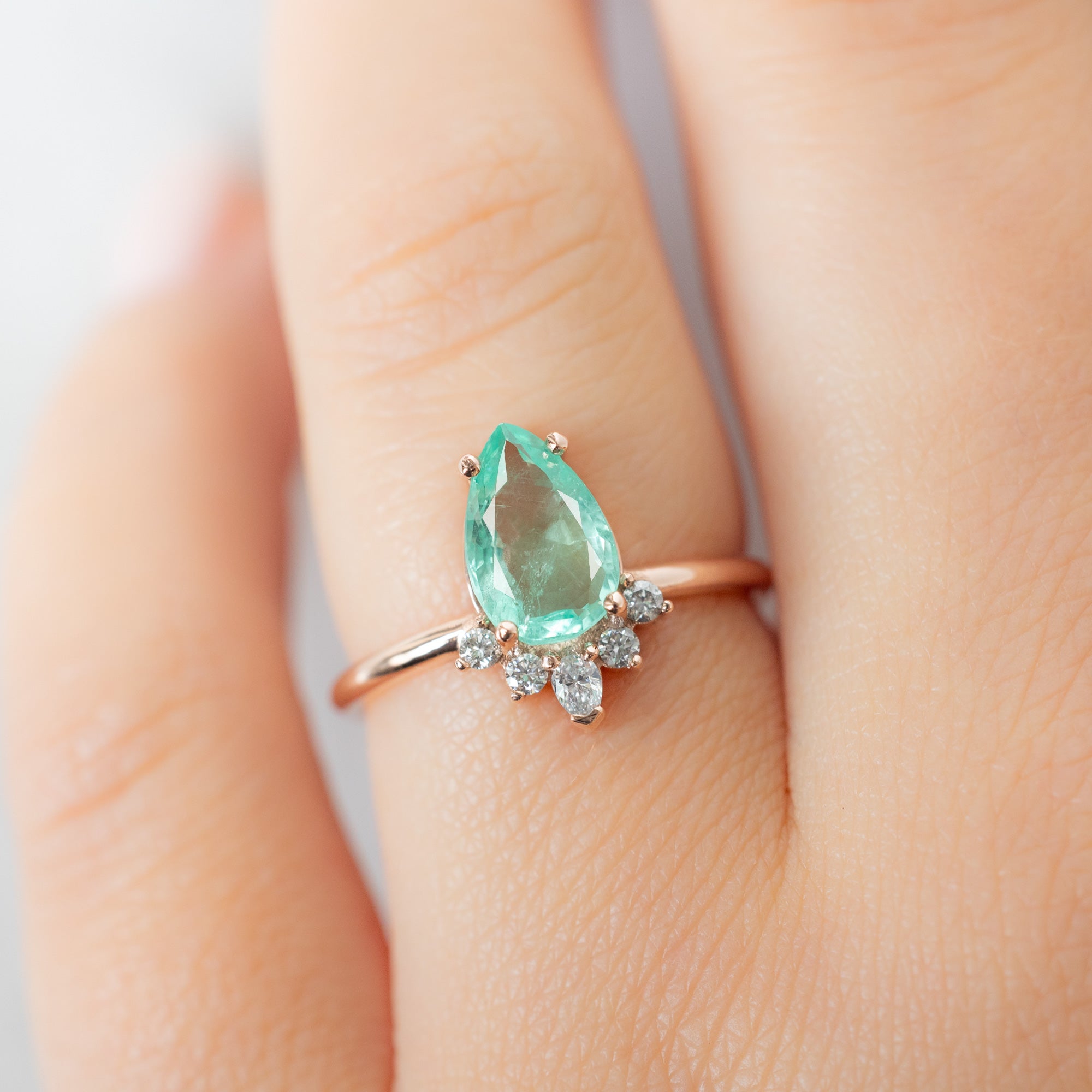 The Aster Ring with a 1.48ct Pear Emerald in 14K Rose Gold on Model