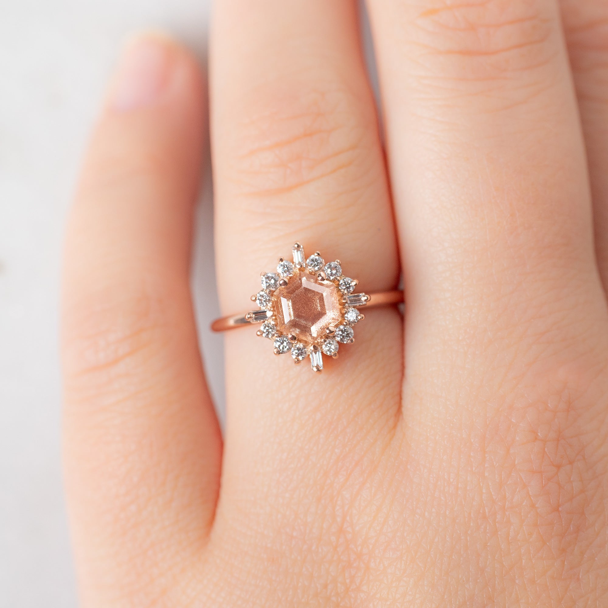 The Compass Ring with a 0.98ct Hexagon Sunstone in 14K Rose Gold on Model