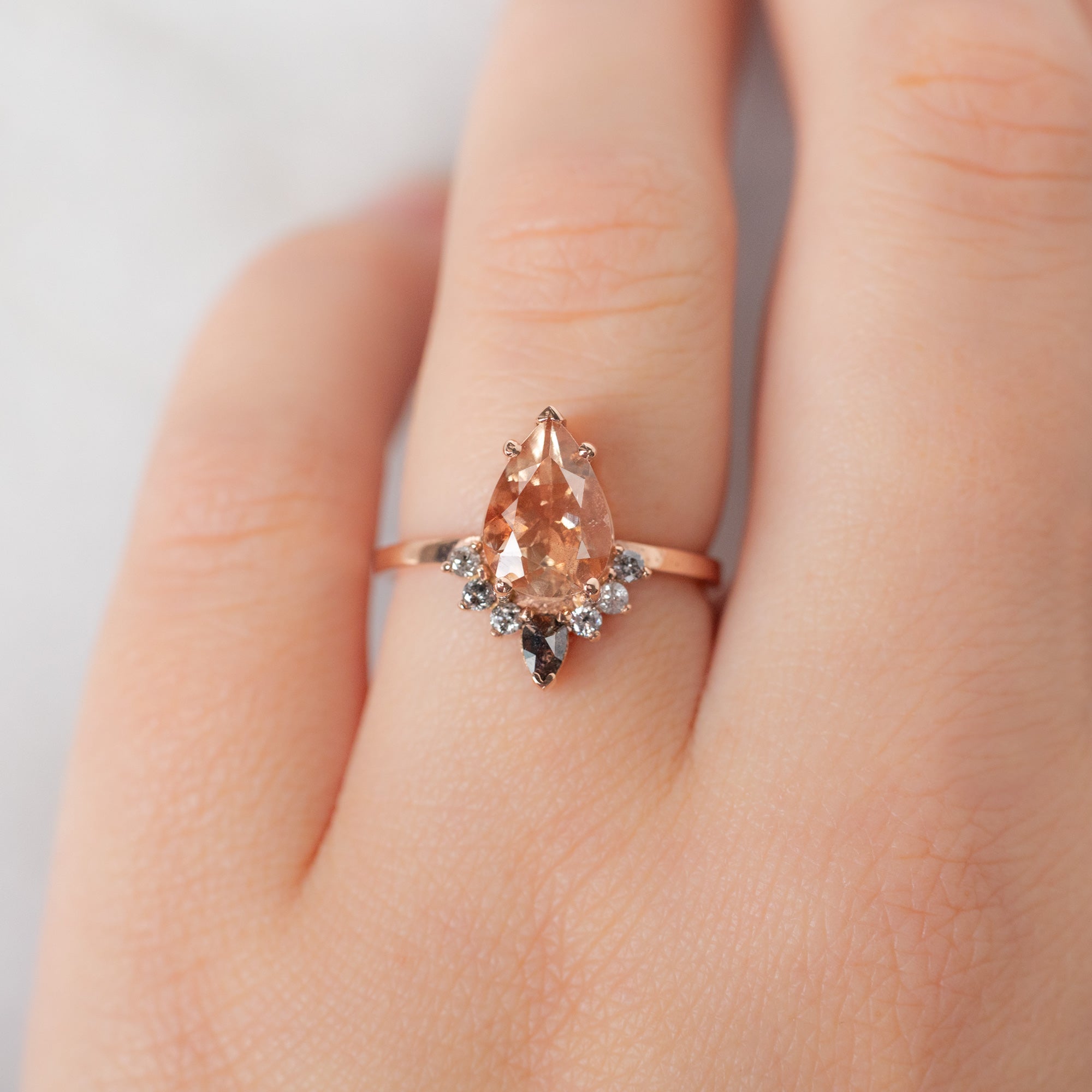The Aster Ring with a 1.96ct Pear Sunstone in 14K Rose Gold on Model