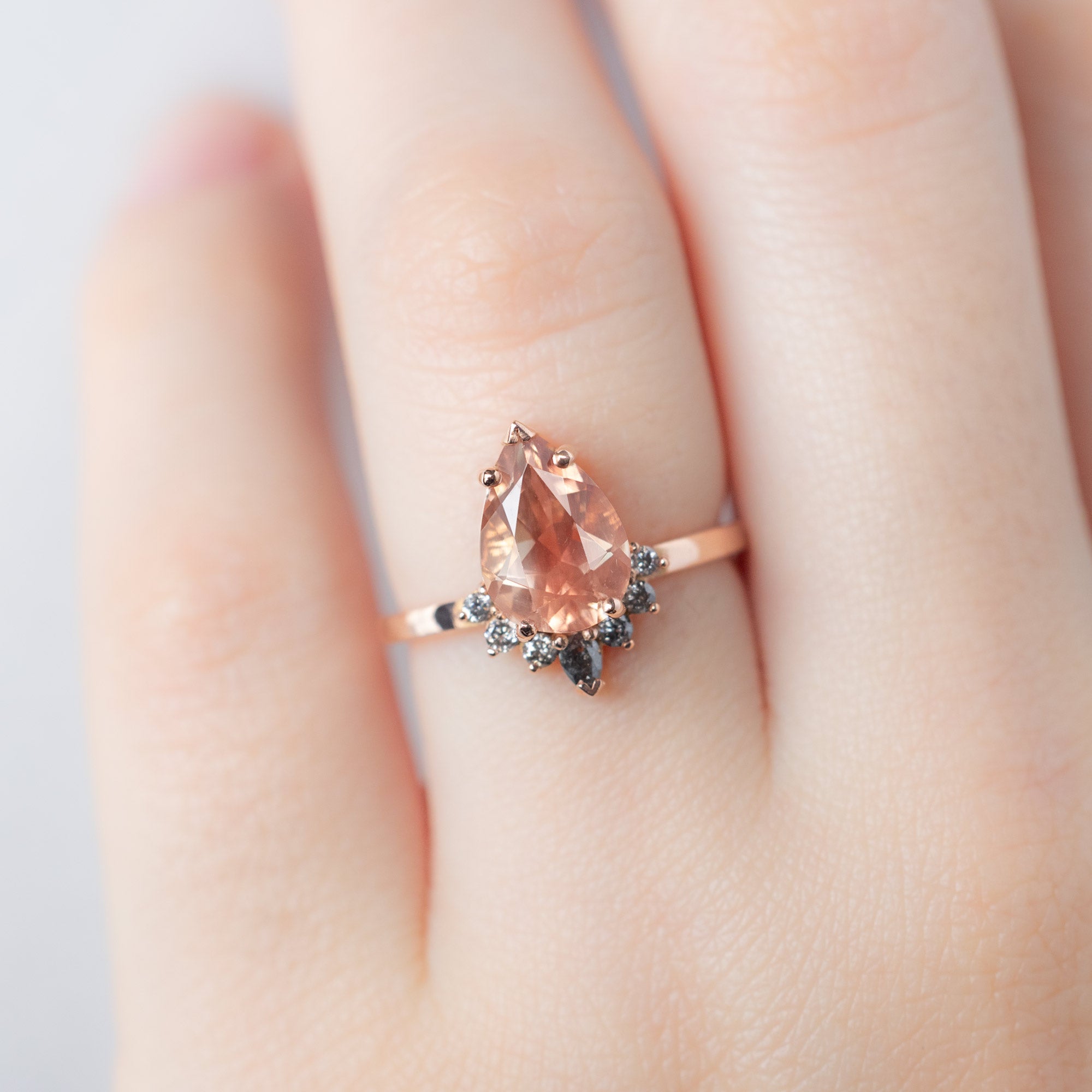 The Aster Ring with a 1.90ct Pear Oregon Sunstone in 14K Rose Gold on Model