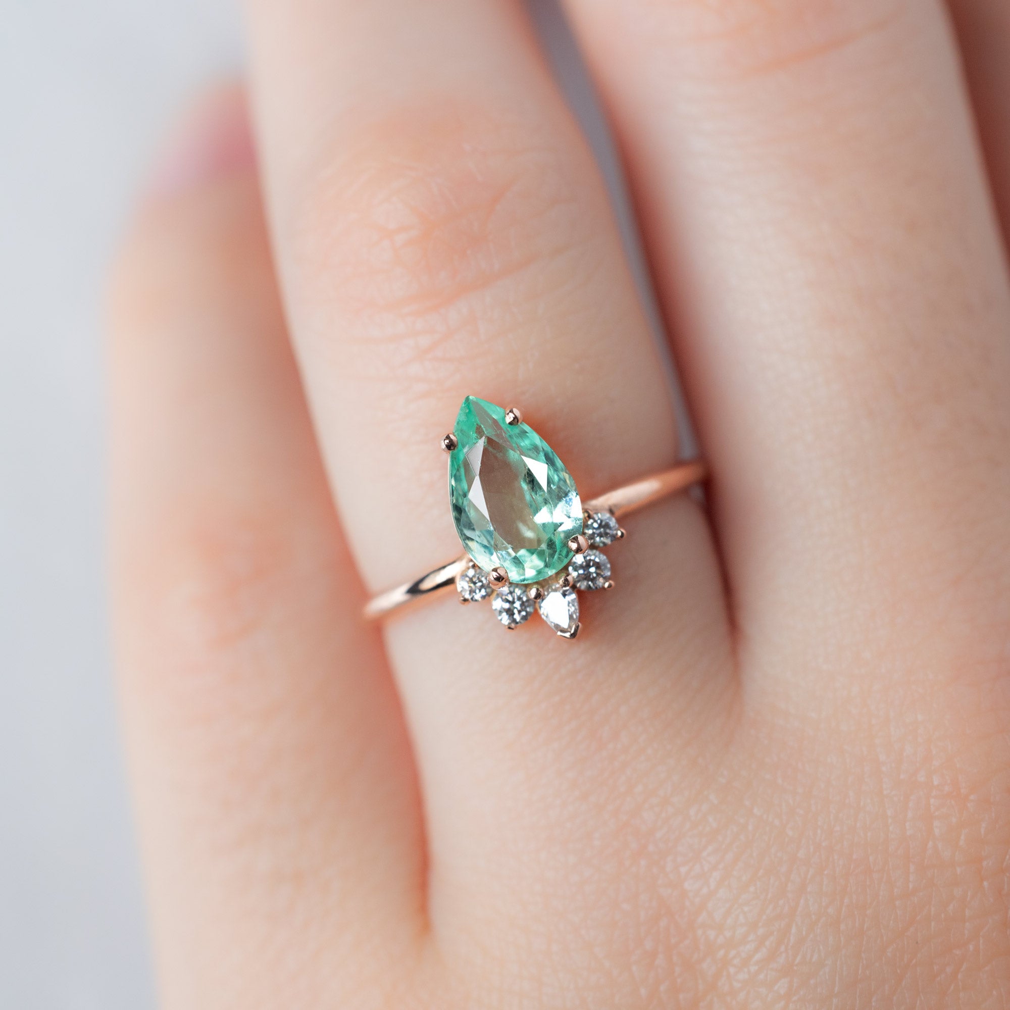 The Aster Ring with a 1.54ct Pear Emerald in 14K Rose Gold on Model