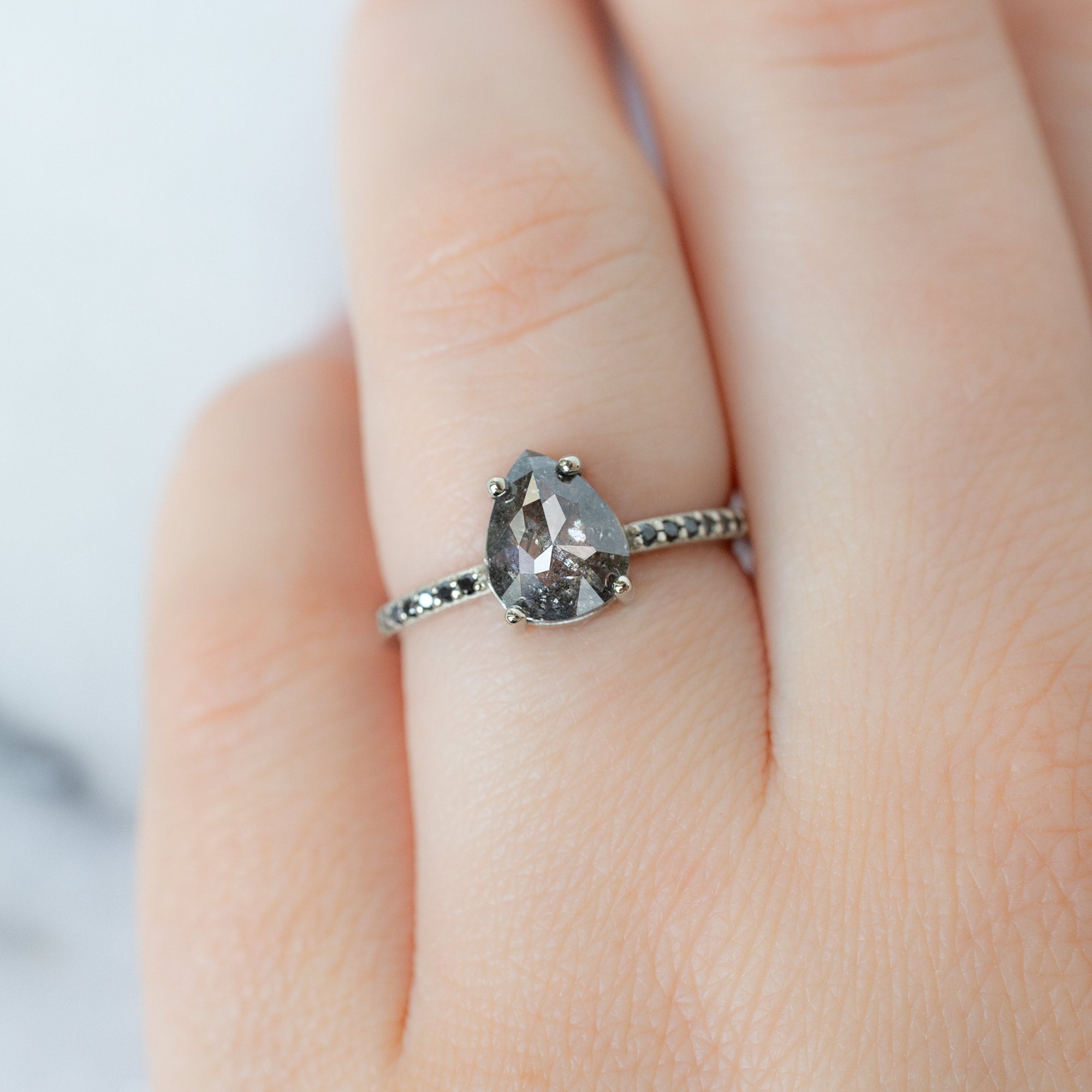 The Willow Ring with a 1.54ct Pear Black Diamond in 14K White Gold on Model