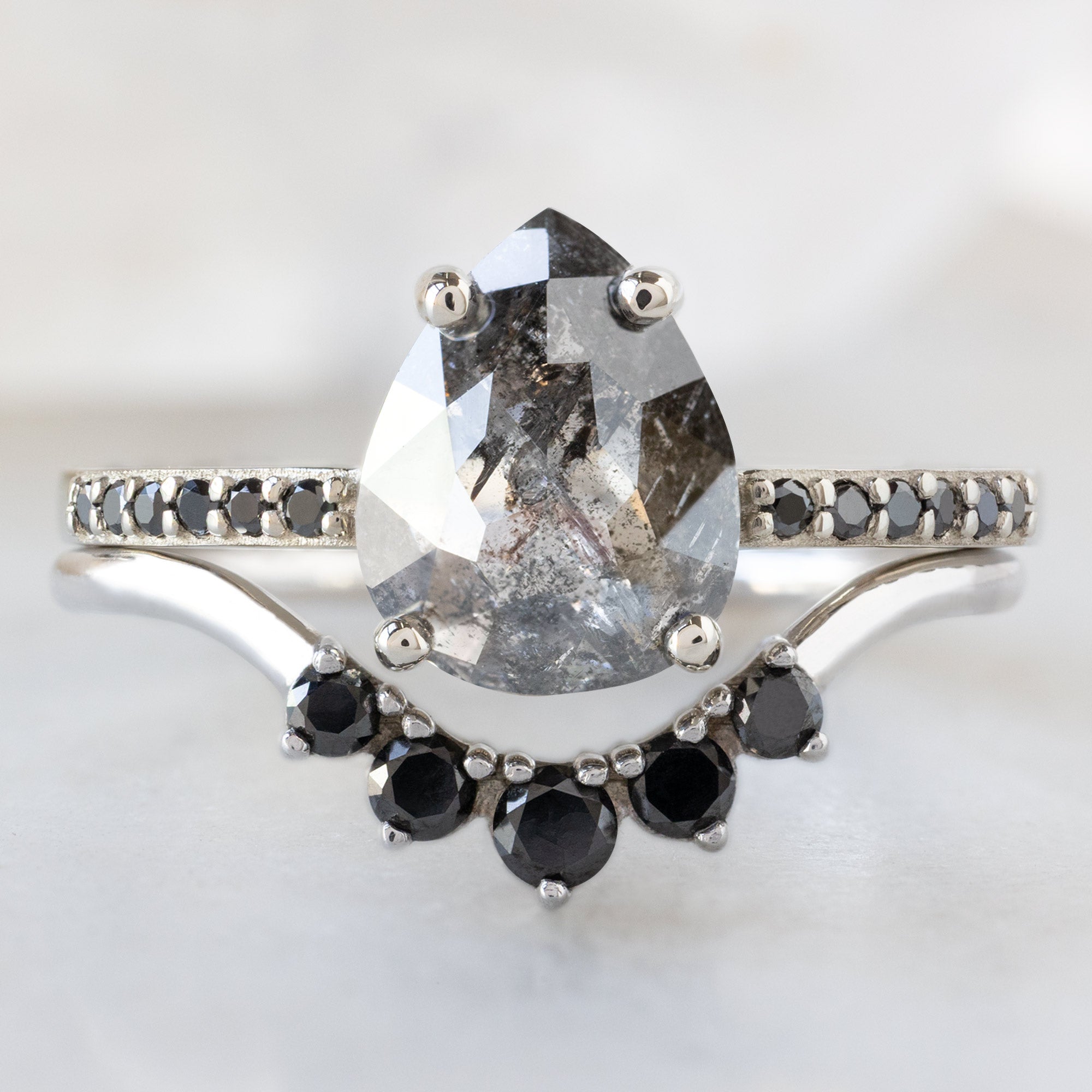 buy:the-willow-ring-1-54ct-pear-black-diamond-in-14k-white-gold,round-black-diamond-sunburst-stacking-band-14k-or-18k-rose-gold