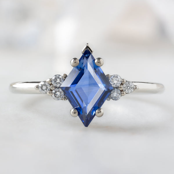 The Ivy Ring with a 1.04ct Kite Blue Sapphire in 14K White Gold on White Marble