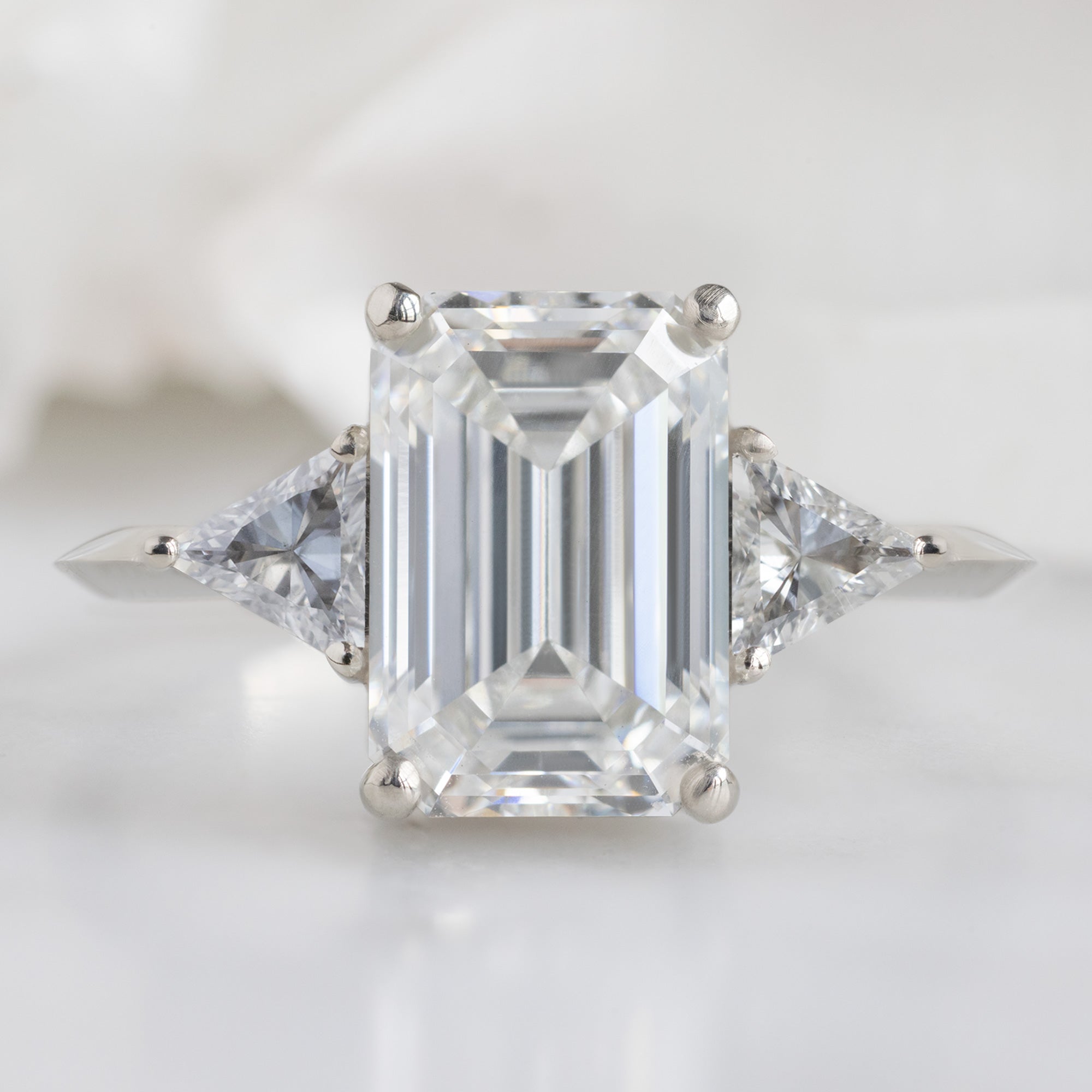 The Jade Ring with a 2.58ct Emerald Cut Lab Grown White Diamond in 14K White Gold on White Marble