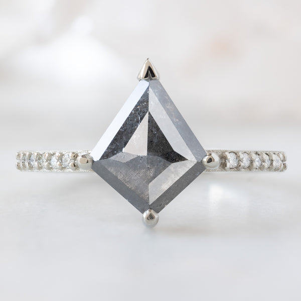 The Willow Ring with a 1.46 Kite Salt and Pepper Diamond in White Gold on White Marble Surface