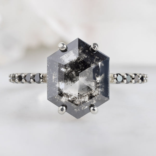 The Luxe Willow Ring with a 2.17ct Lab Grown Salt and Pepper Hexagon Diamond in 14K White Gold on White Marble Surface