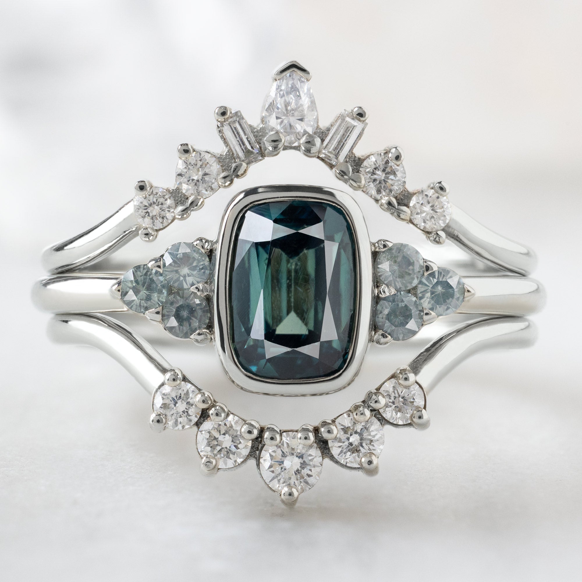 buy:geometric-white-diamond-sunburst-stacking-band-14k-or-18k-yellow-gold,the-ivy-ring-1-24ct-cushion-cut-blue-sapphire-in-14k-white-gold,round-white-diamond-sunburst-stacking-band-14k-or-18k-yellow-gold