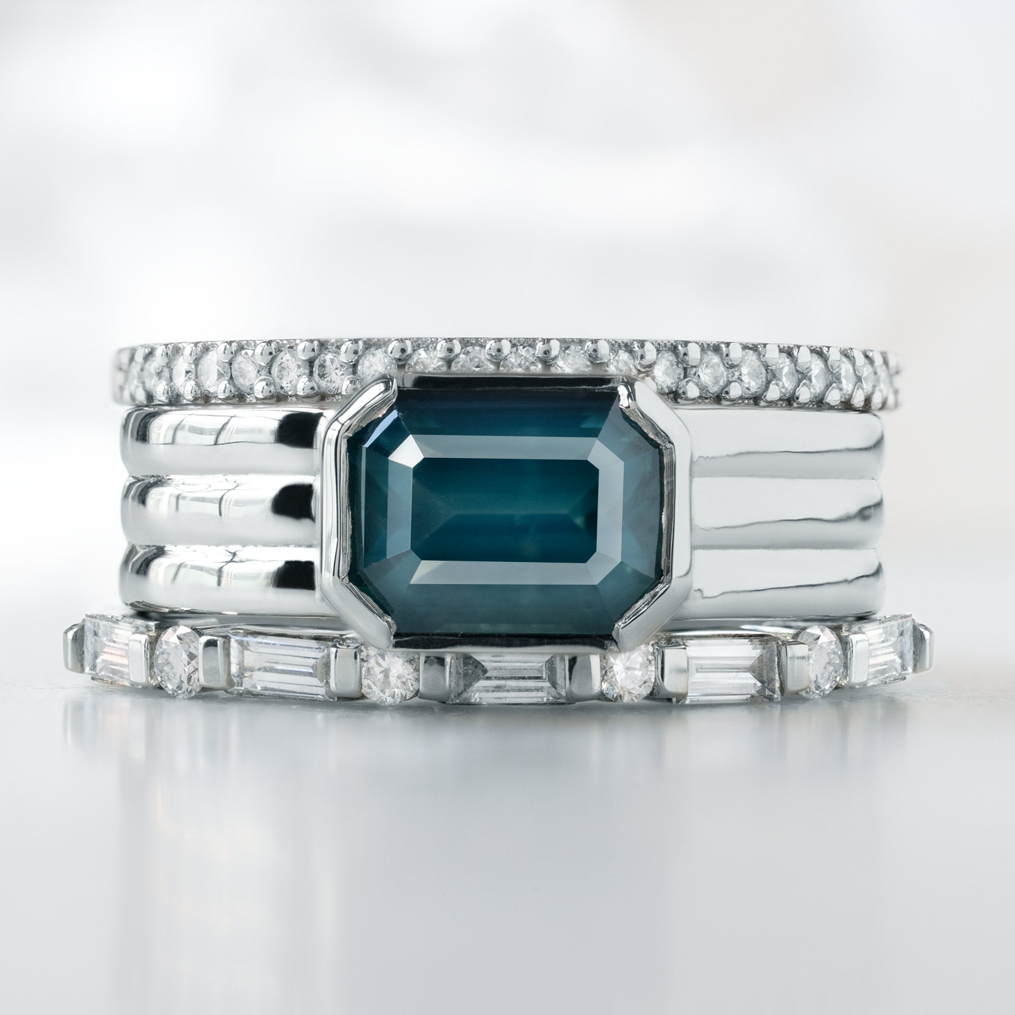 buy:the-white-diamond-pave-wedding-band-14k-or-18k-yellow-gold,the-stratum-ring-2ct-emerald-cut-blue-sapphire-in-14k-white-gold,the-luxe-baguette-white-diamond-eternity-band-yellow-rose-or-white-gold